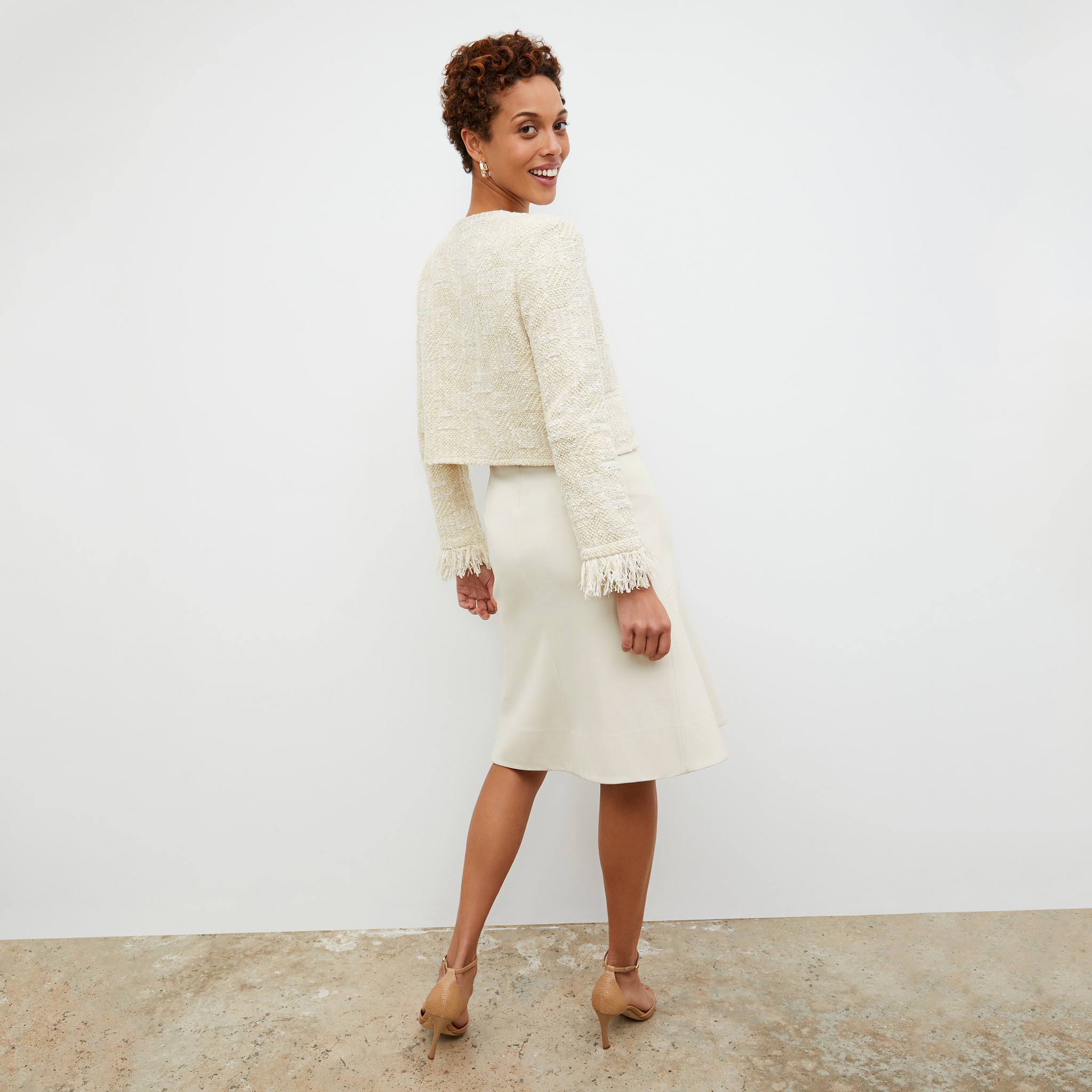 Back image of a woman wearing the Lilia Jacket - Interweave in Taupe / Ivory