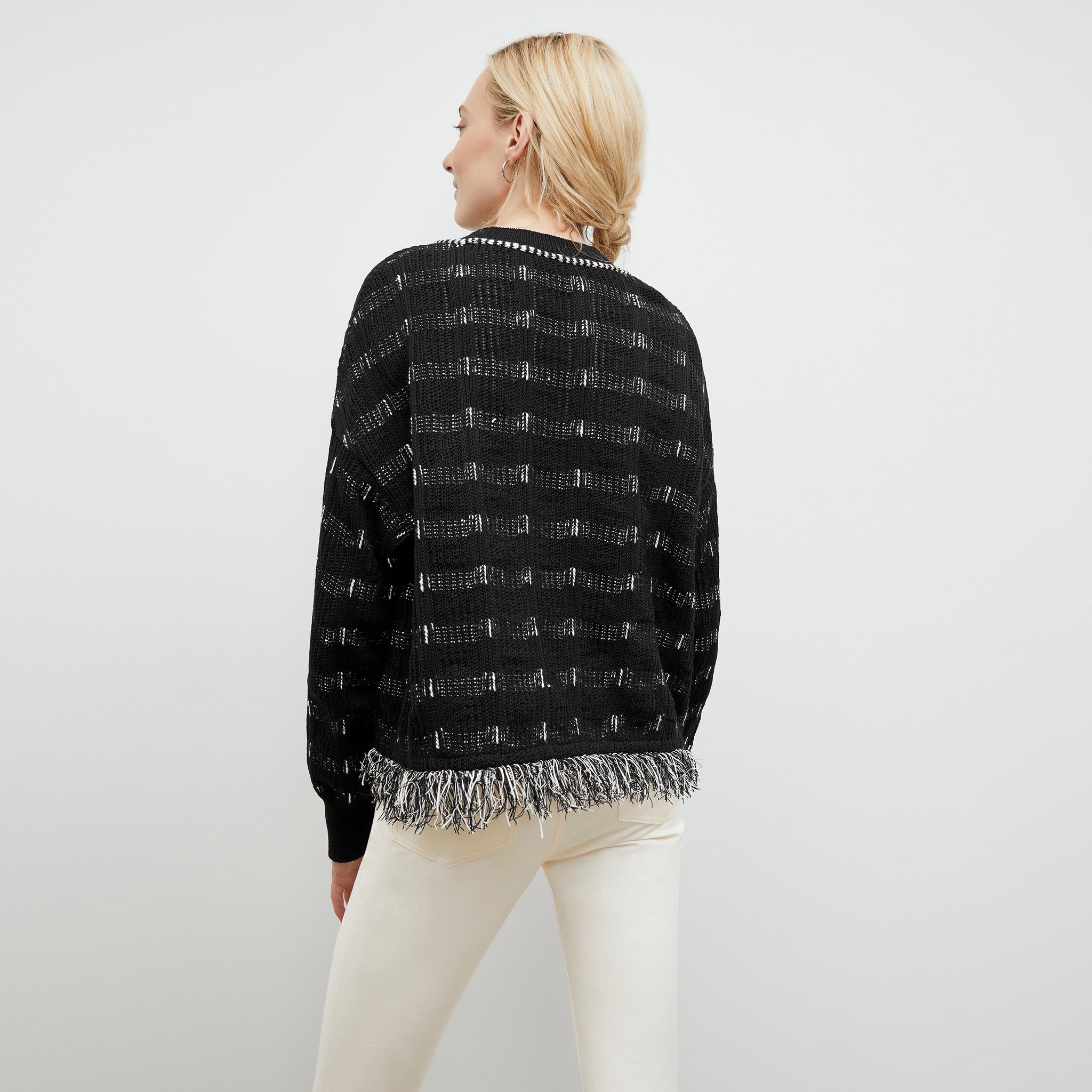 Back image of a woman wearing the Figari Pullover - Linear Interweave in Black / White