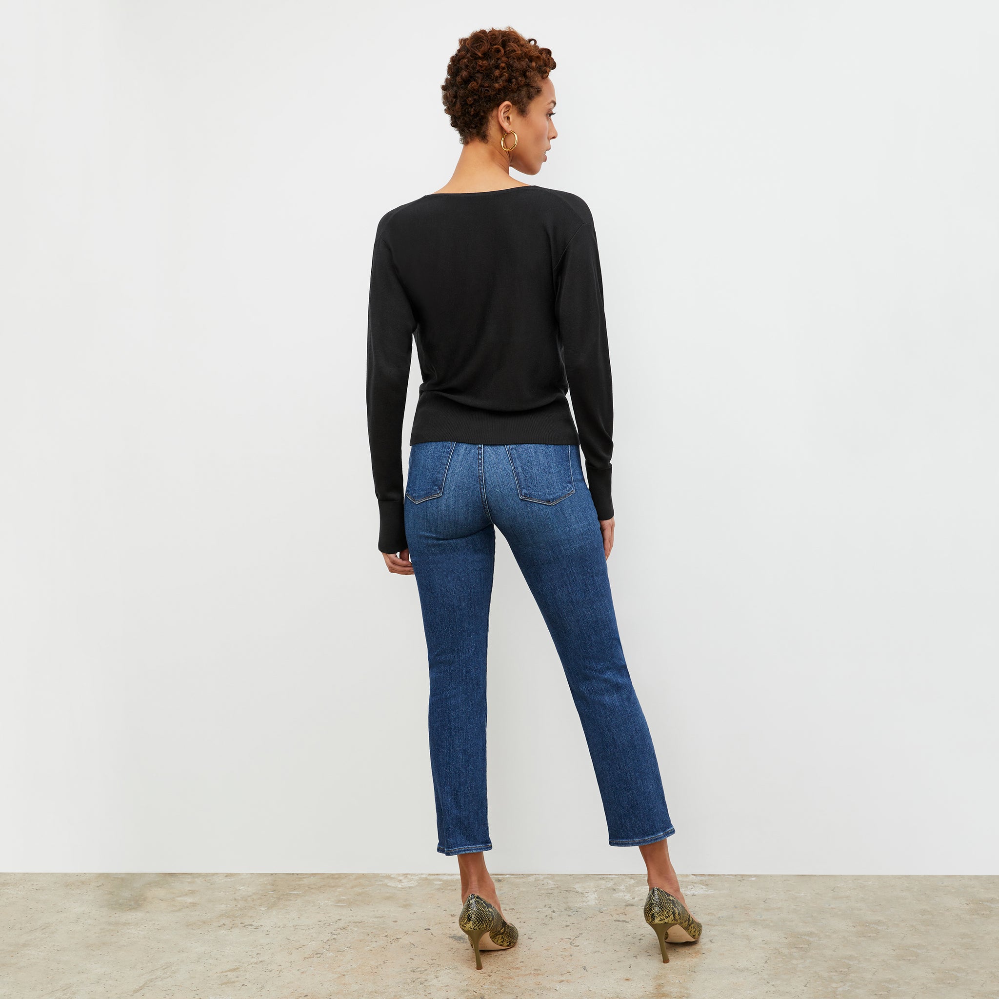 Back image of a woman wearing the Monica Top in Black
