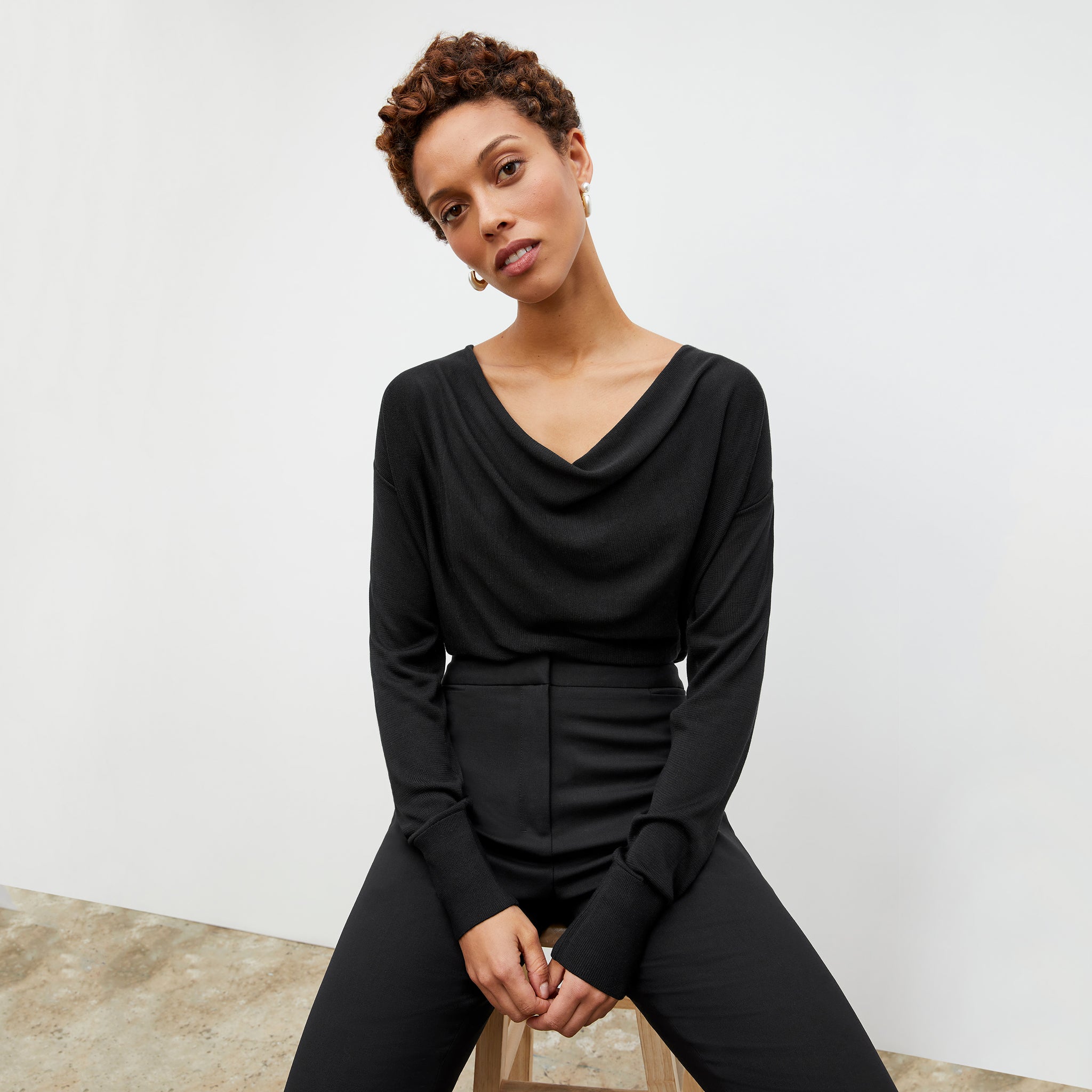Front image of a woman wearing the Monica Top in Black 
