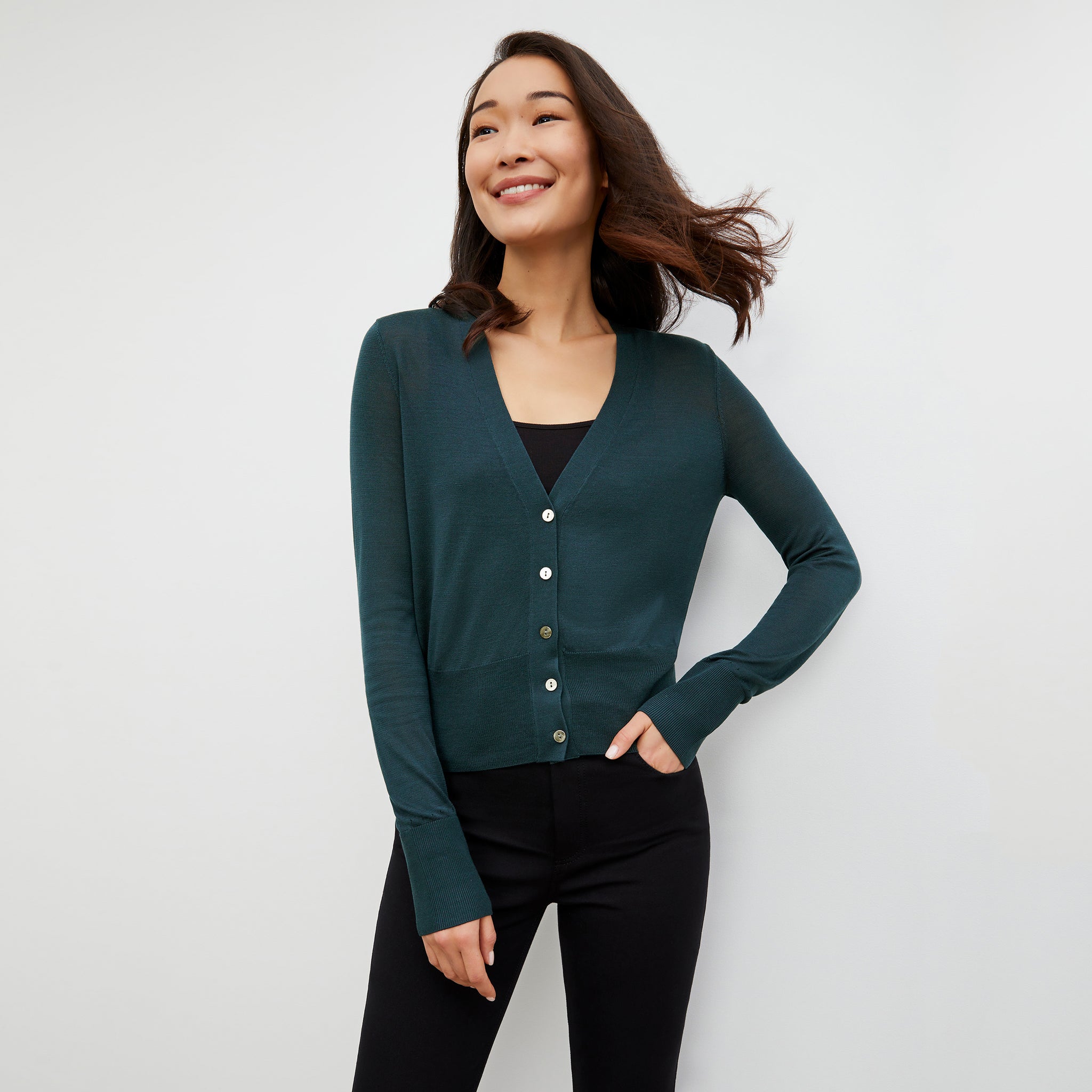 Front image of a woman wearing the Rory Cardigan - Silk Jersey in Deep Sea 