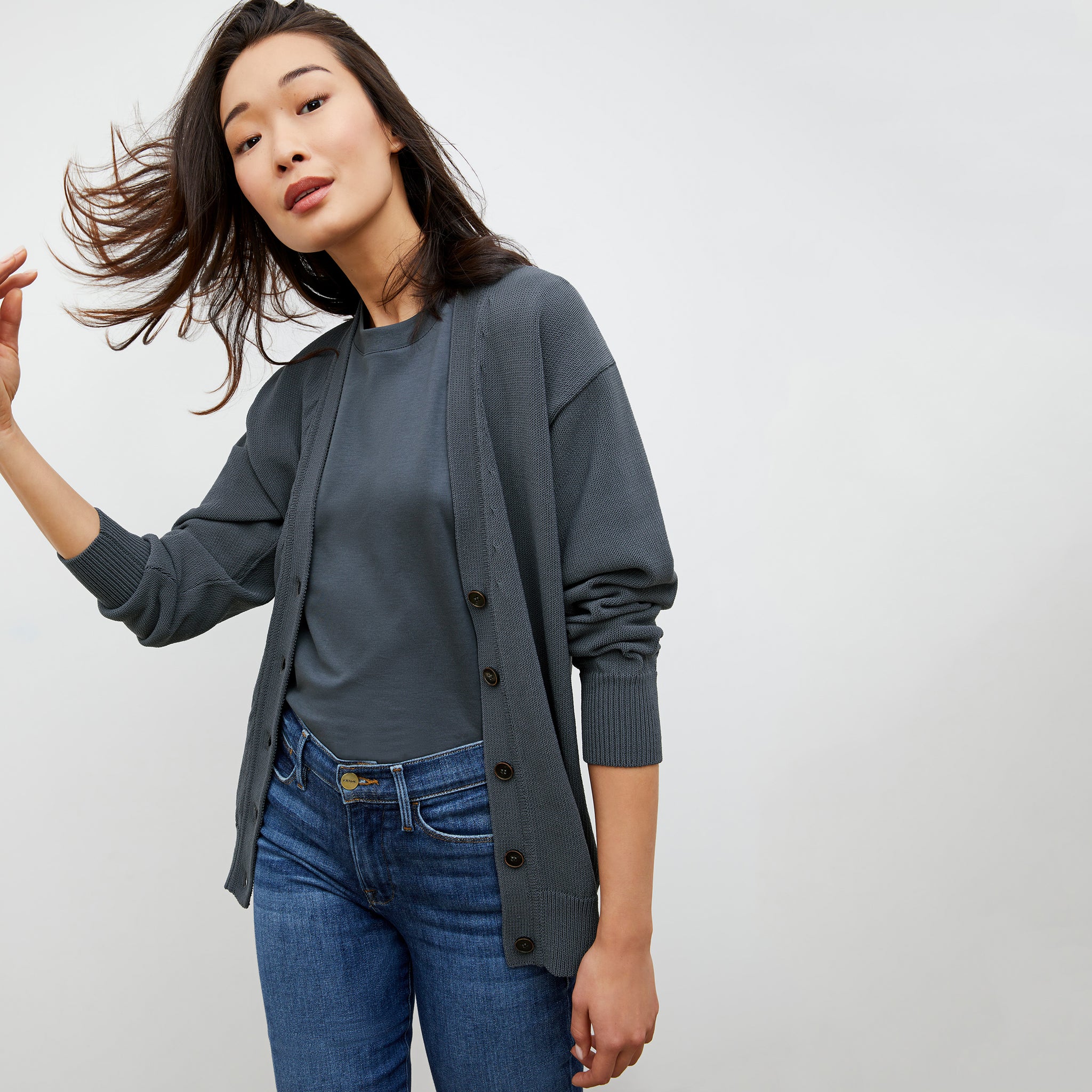 Front image of a woman wearing the Cookie Cardigan - Sleek Cotton in Dusty Indigo