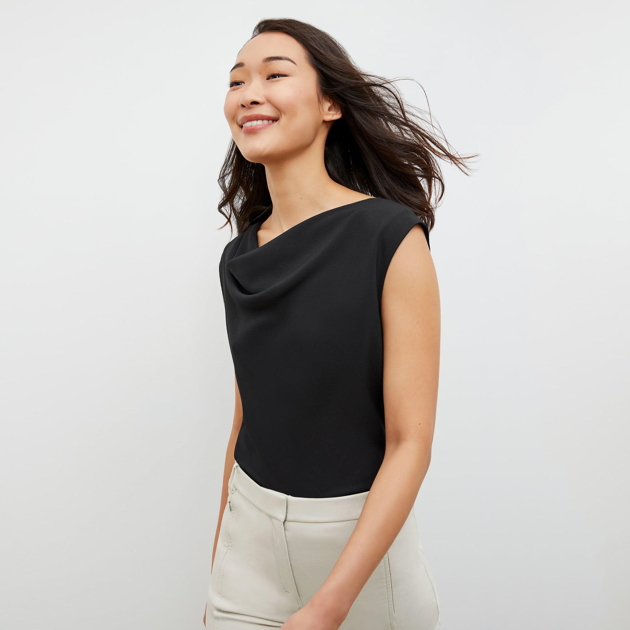 Front image of a woman wearing the Nora Top in Black 