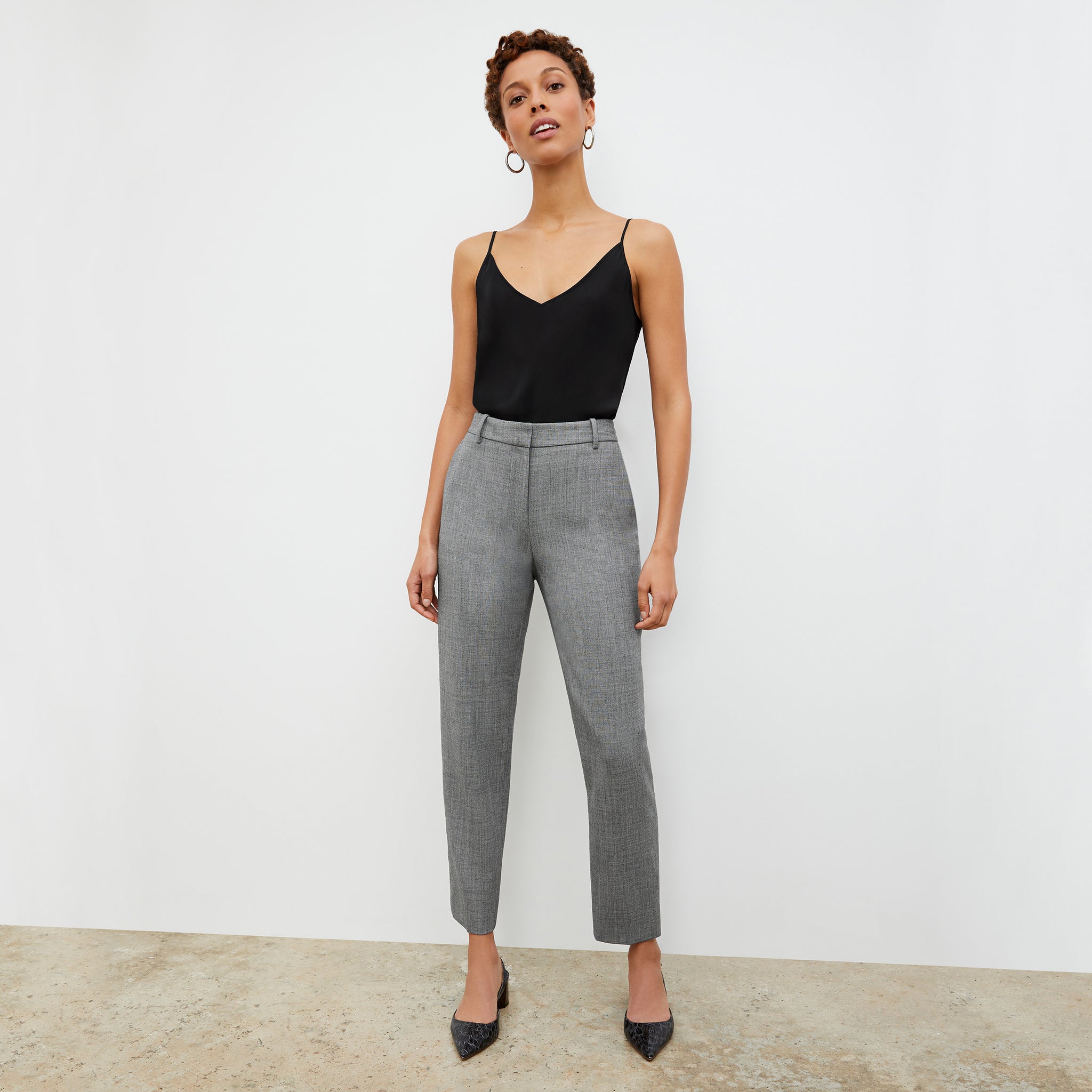 Front image of a woman wearing the Mejia Pant in Black and White Sharkskin 
