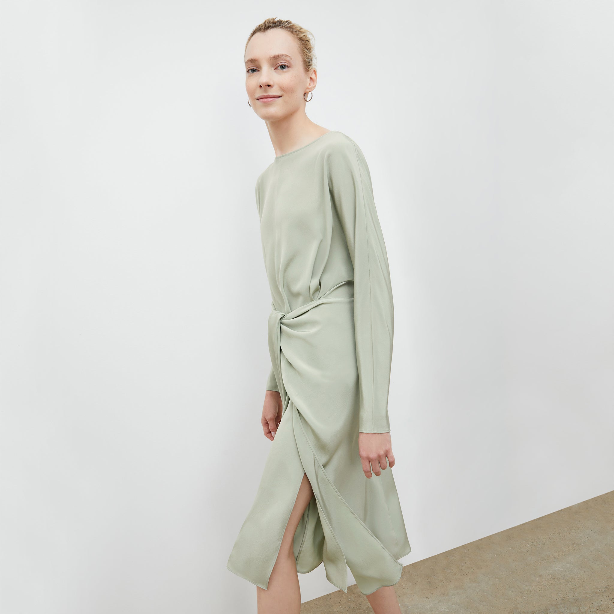 Front image of a woman wearing the Rashmeen dress in Minty Green