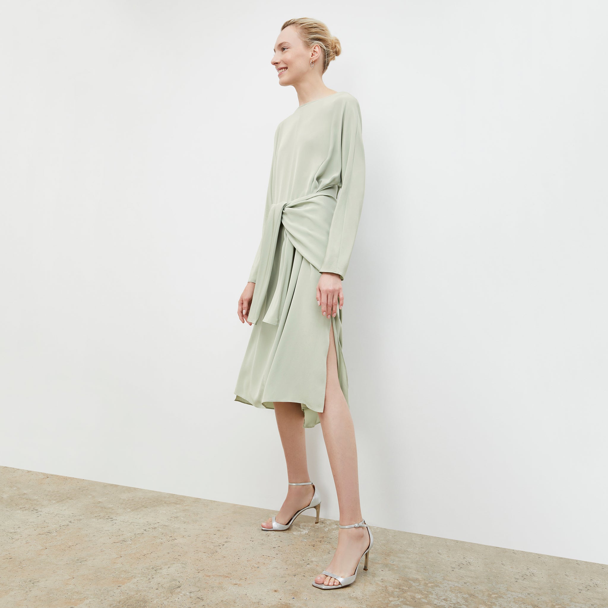 Front image of a woman wearing the Rashmeen dress in Minty Green