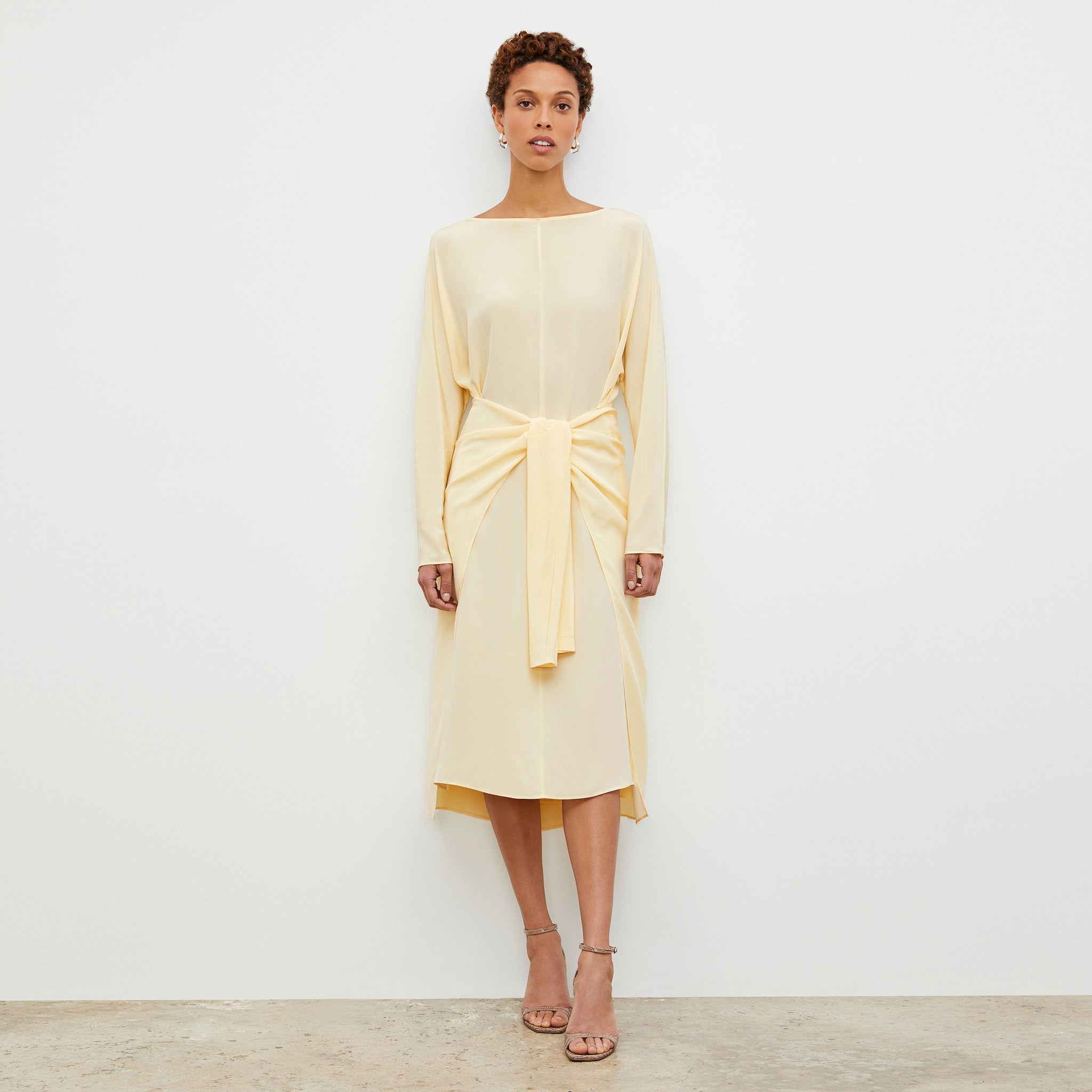 Front image of a woman wearing the Rashmeen Dress - Washable Silk in Parchment 