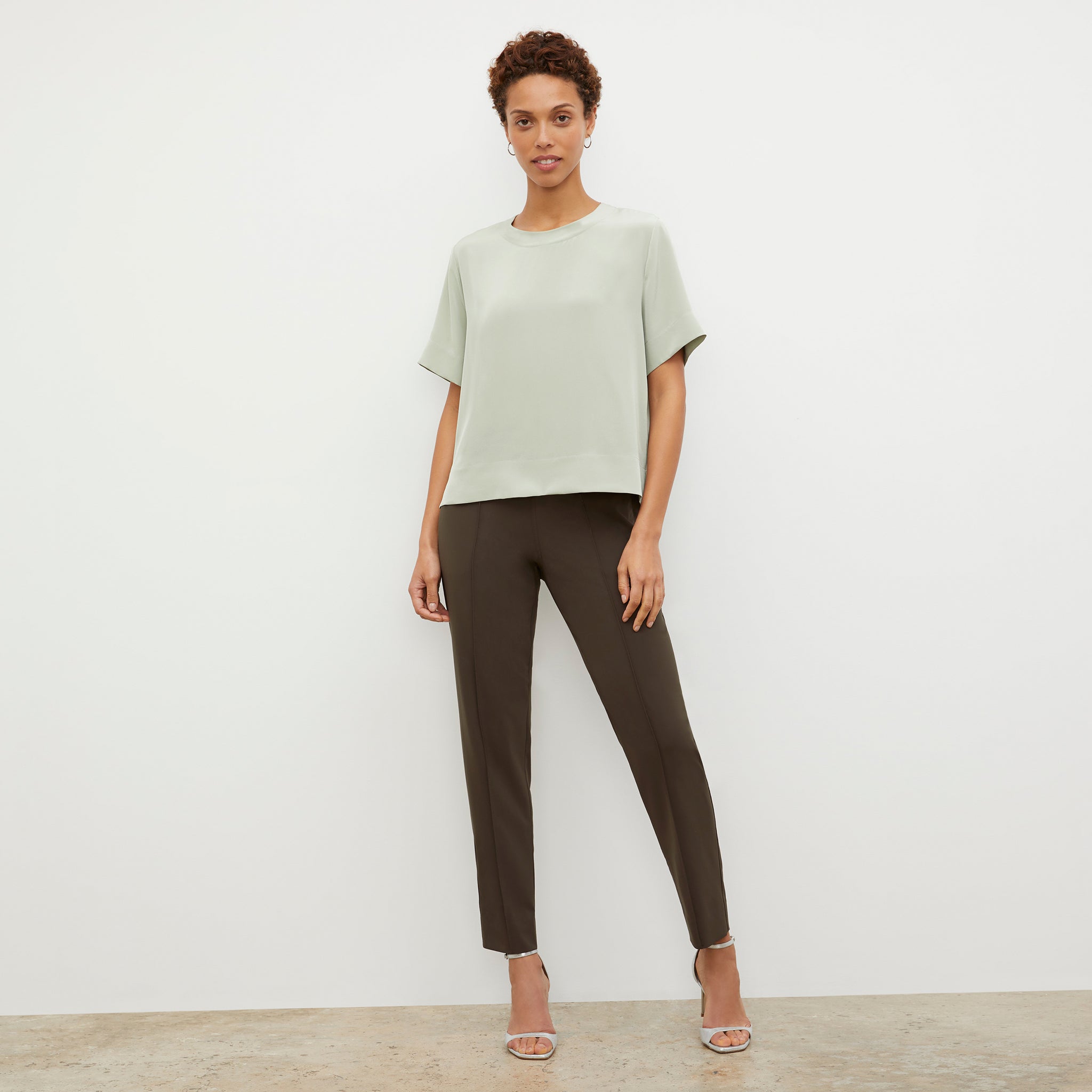 Front image of a woman wearing the Annika Tee in Minty Green 