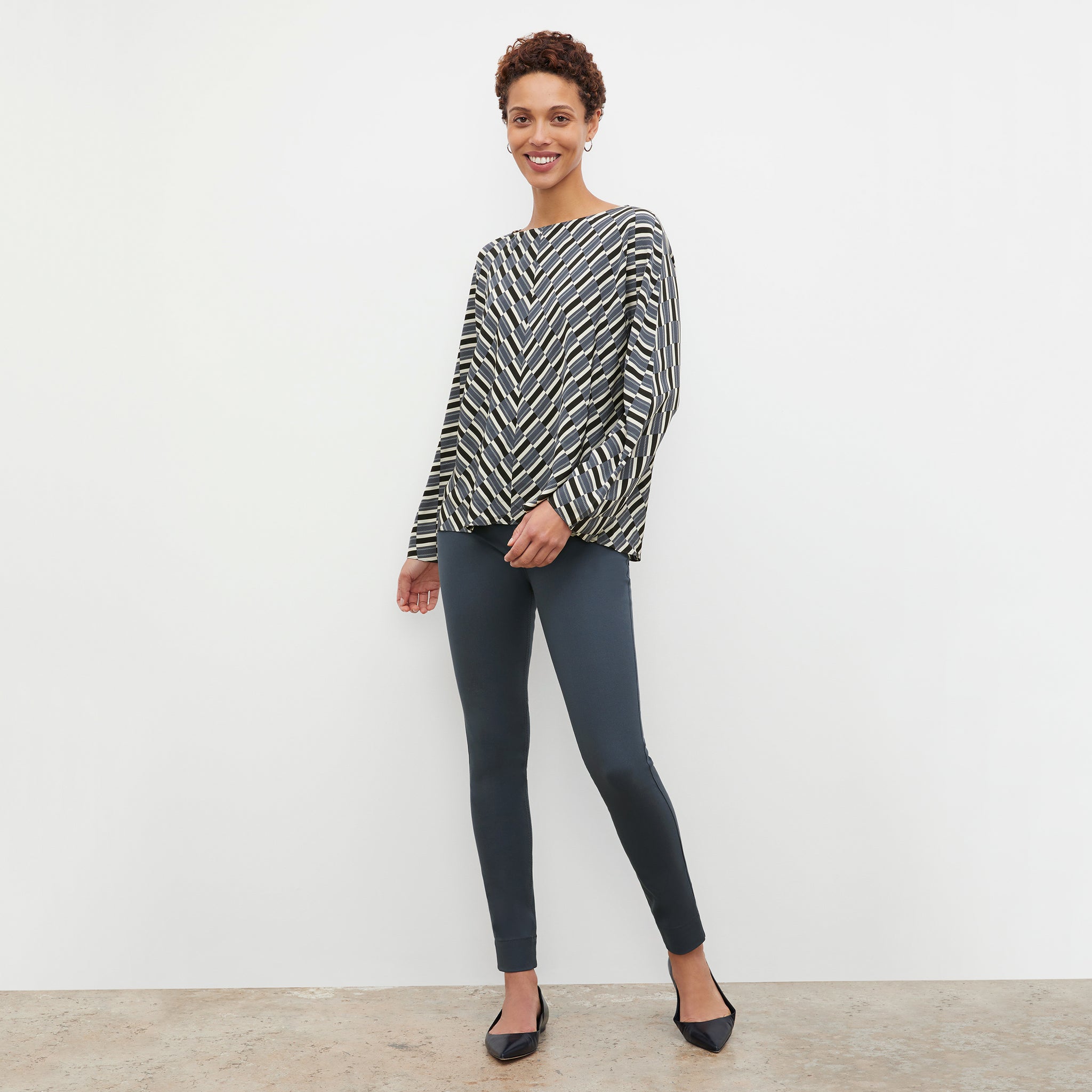 Front image of a woman wearing the Wren Top - Arpeggio Print Washable Silk in Blue / Black 