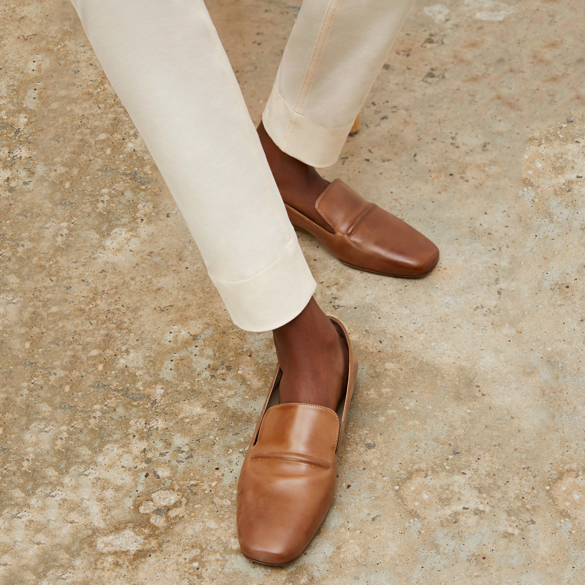 Front image of a woman wearing the Grace Loafer in Cognac