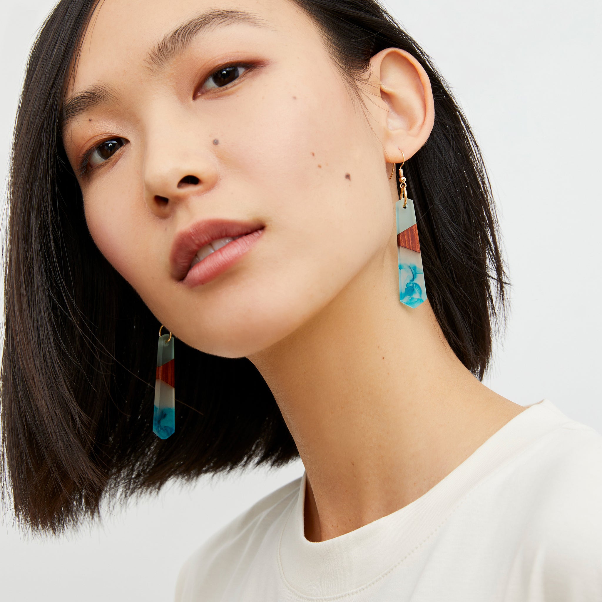 image of a woman wearing the noemi earrings