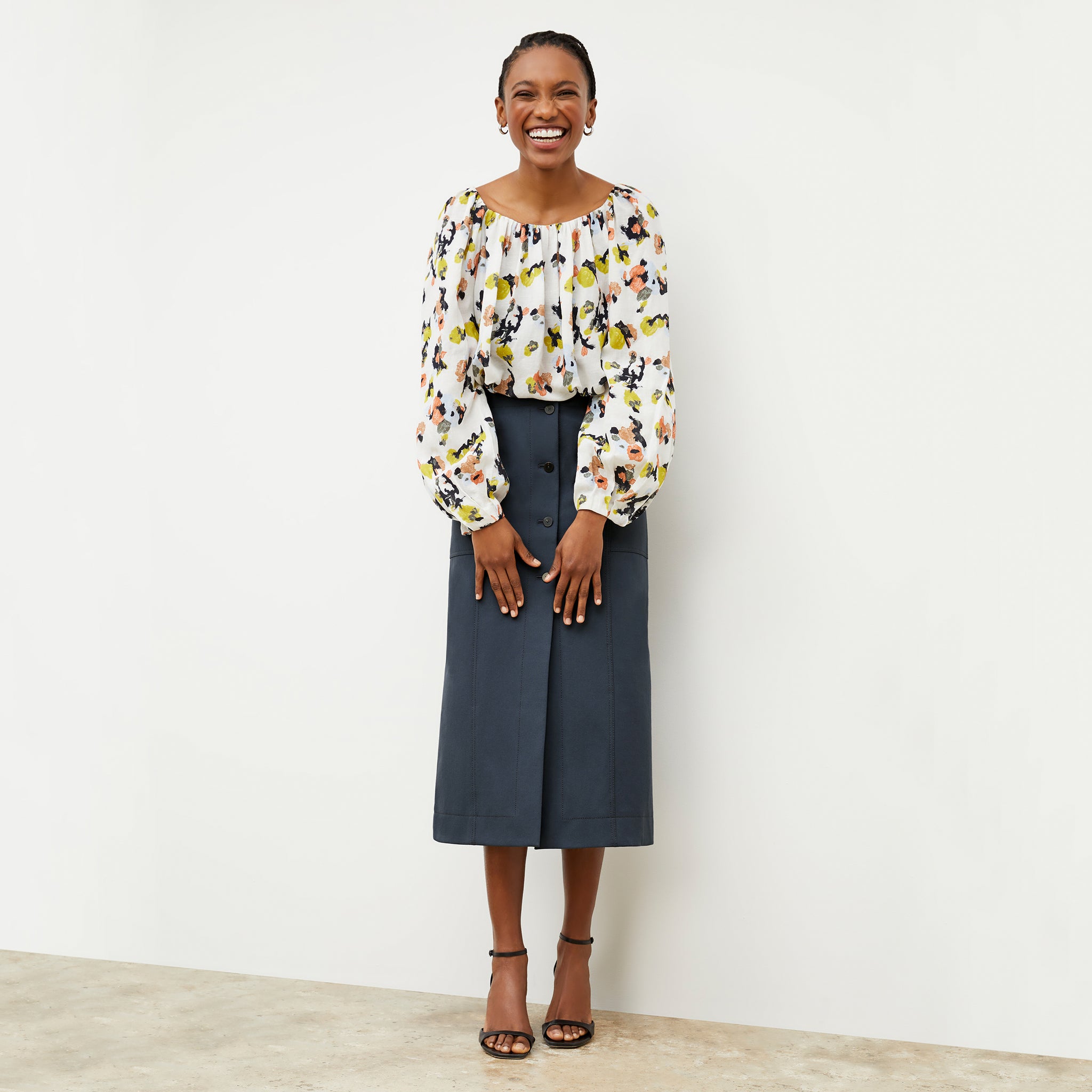 Front image of a woman wearing the Lane skirt in Dusty Indigo 