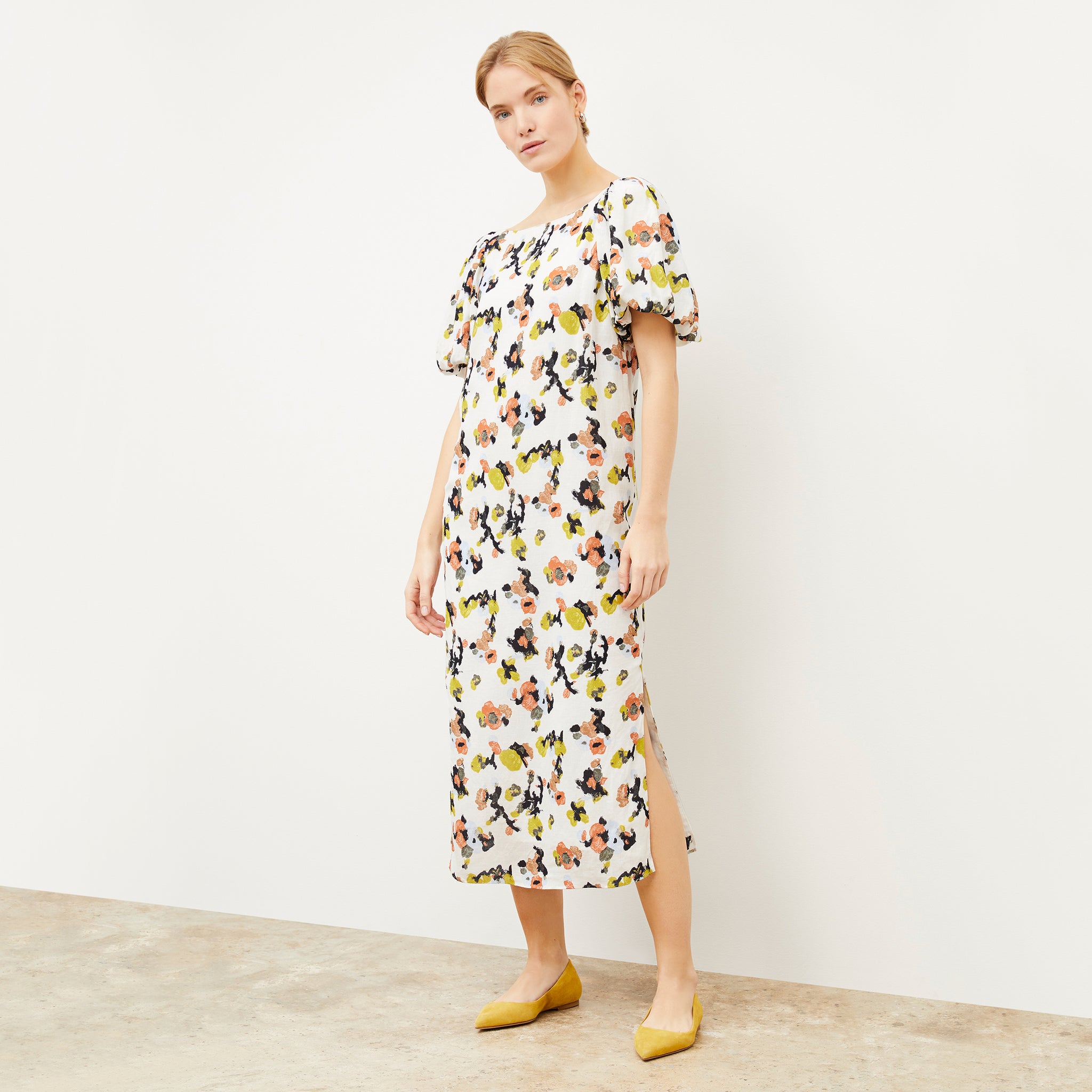 Front image of a woman wearing the Gali dress in meadow print linen