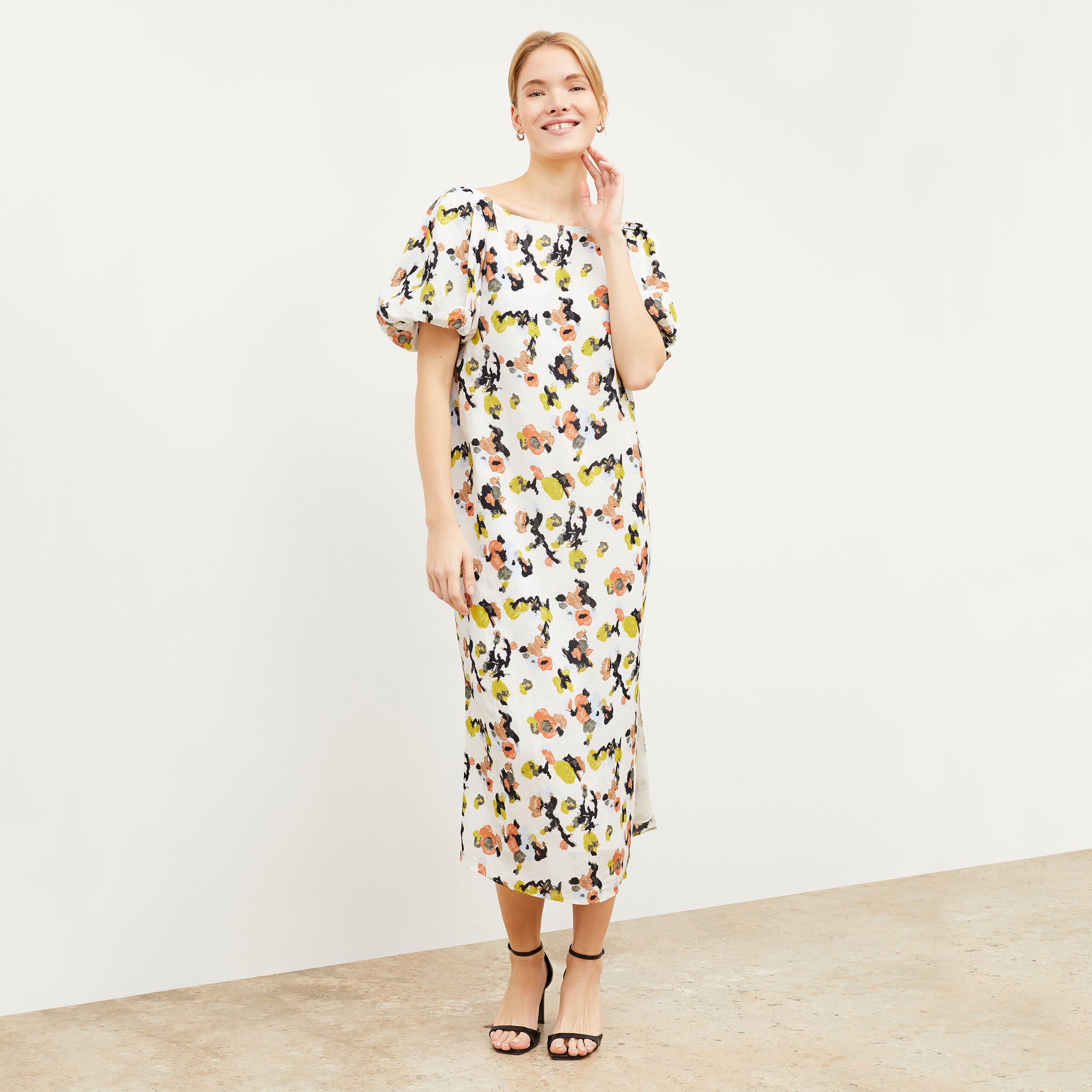 Front image of a woman wearing the Gali dress in meadow print linen 