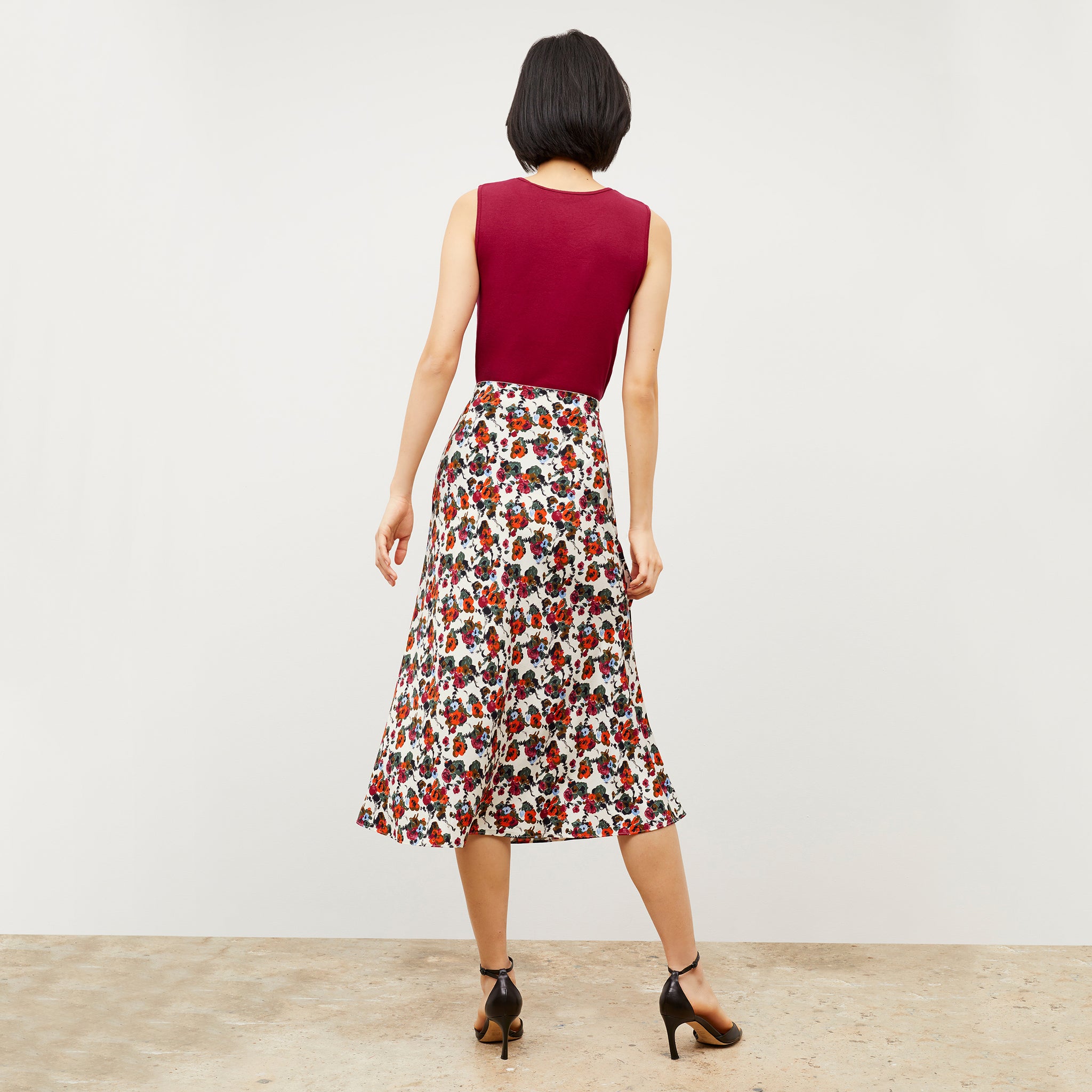 Back image of a woman wearing the Orchard Skirt - Washable Silk in Garden Print