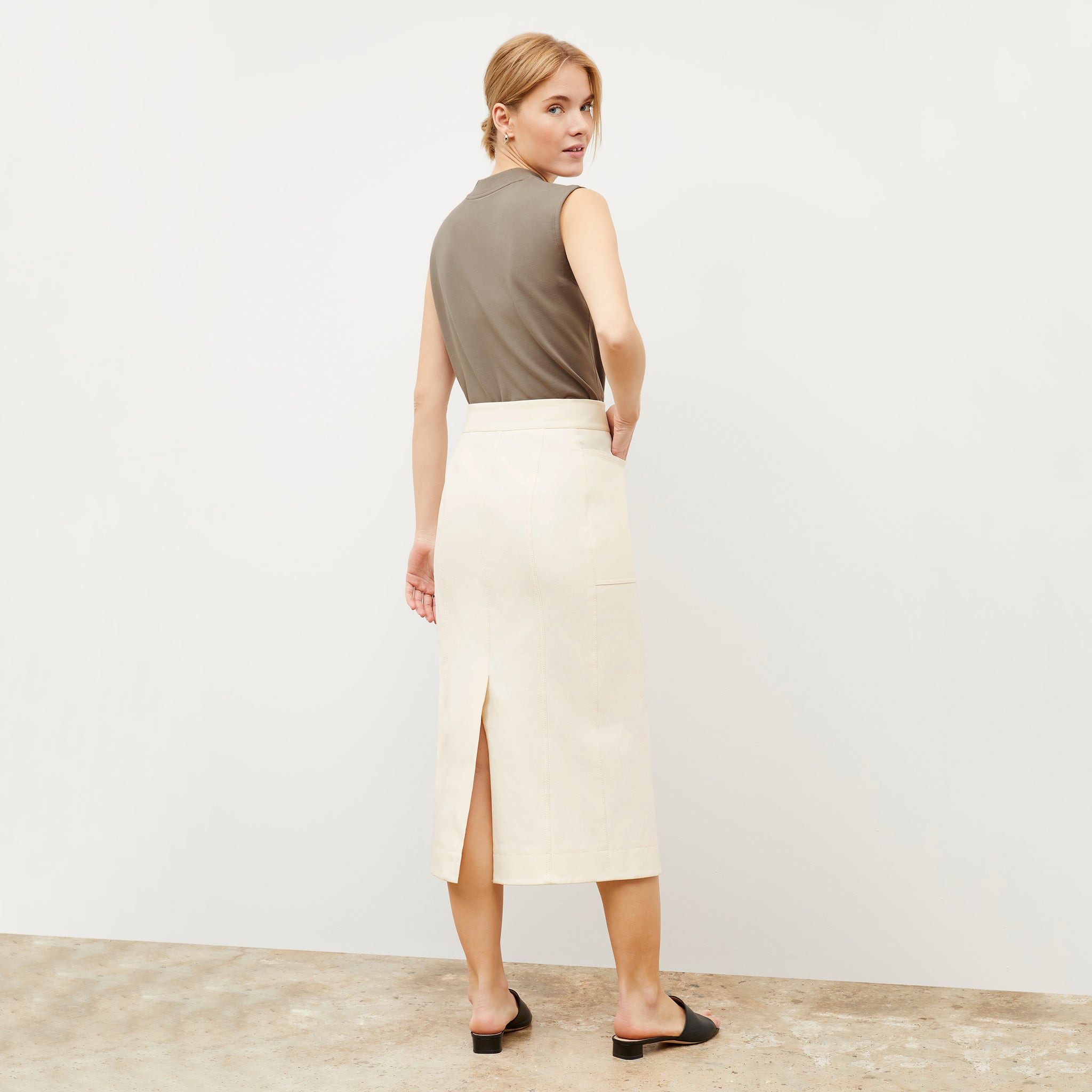 Back image of a woman wearing the Lane skirt in Tusk