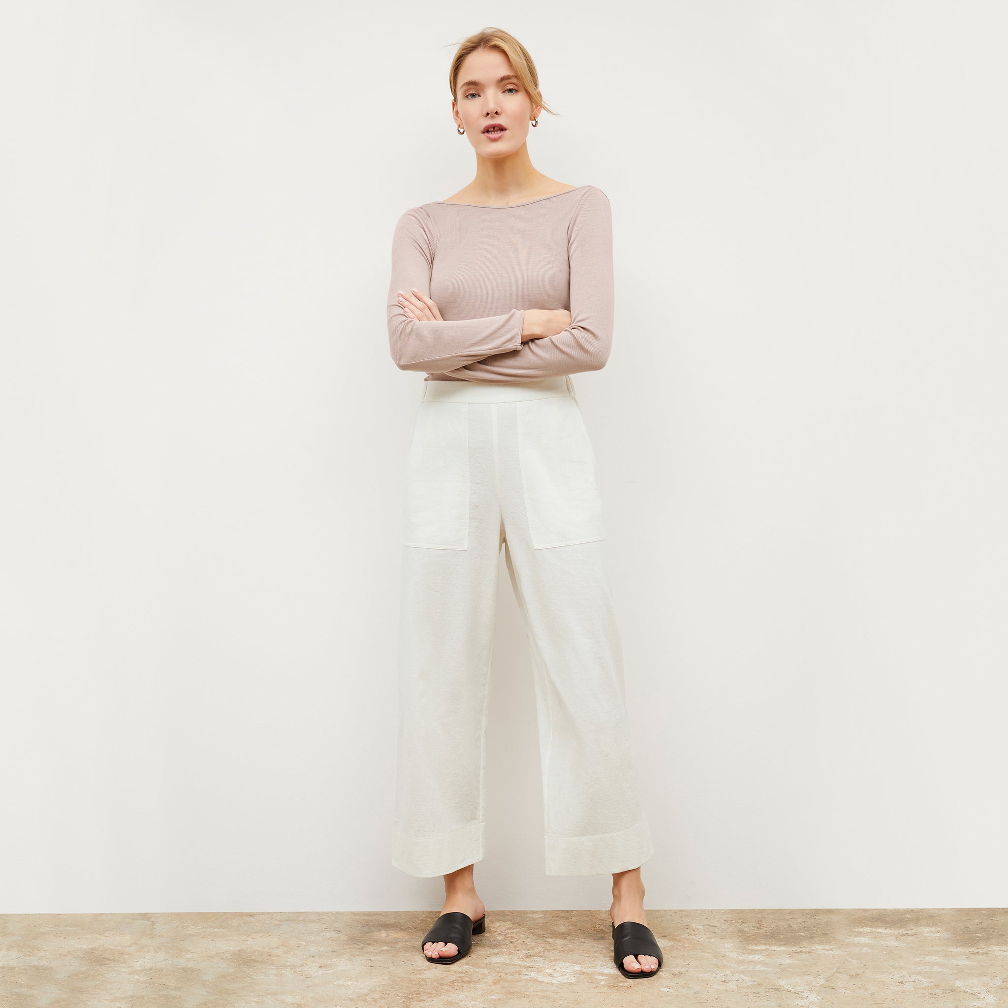 Image of a woman wearing the Madelyn Pant in Ivory 