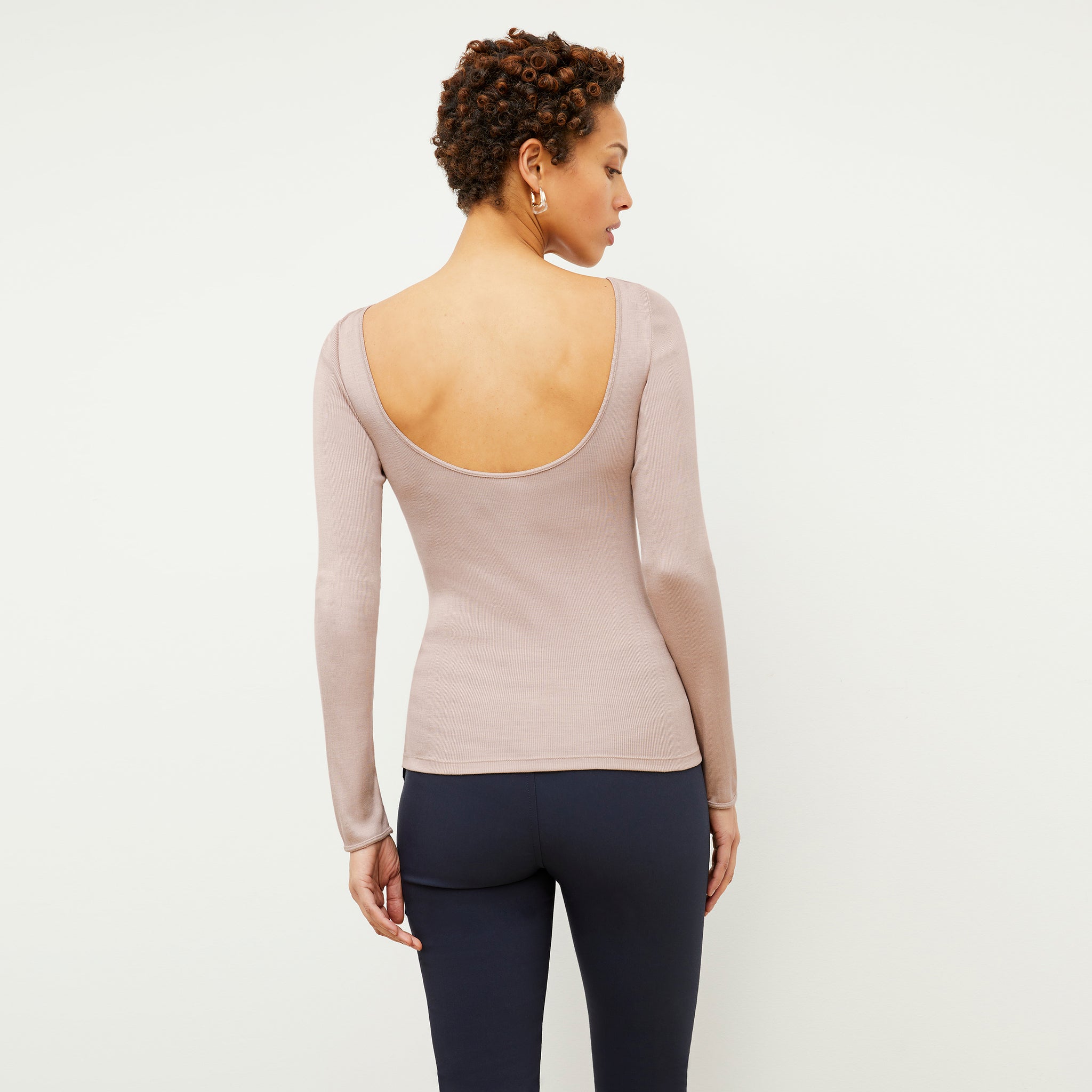 Back image of a woman wearing the Meg Top in Blush