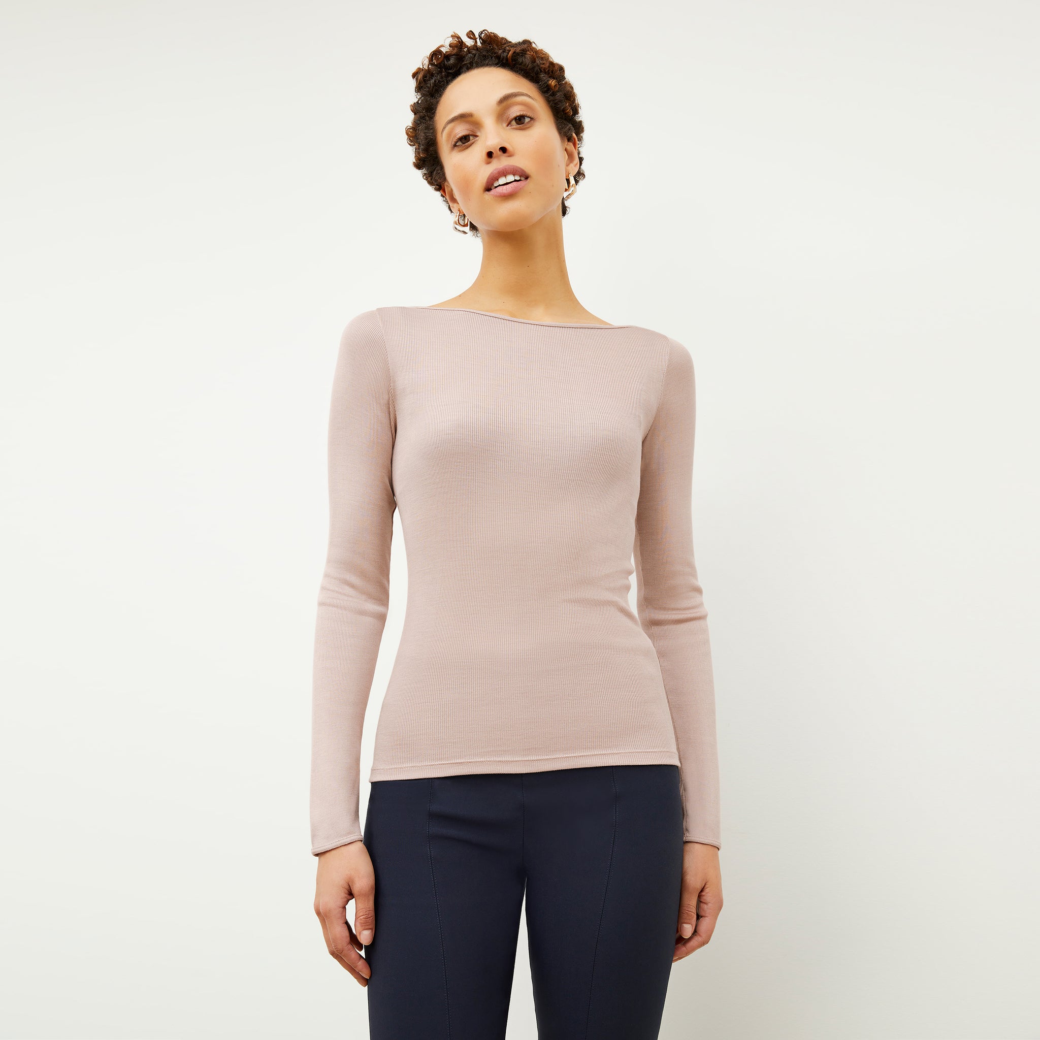 Front image of a woman wearing the Meg Top in Blush