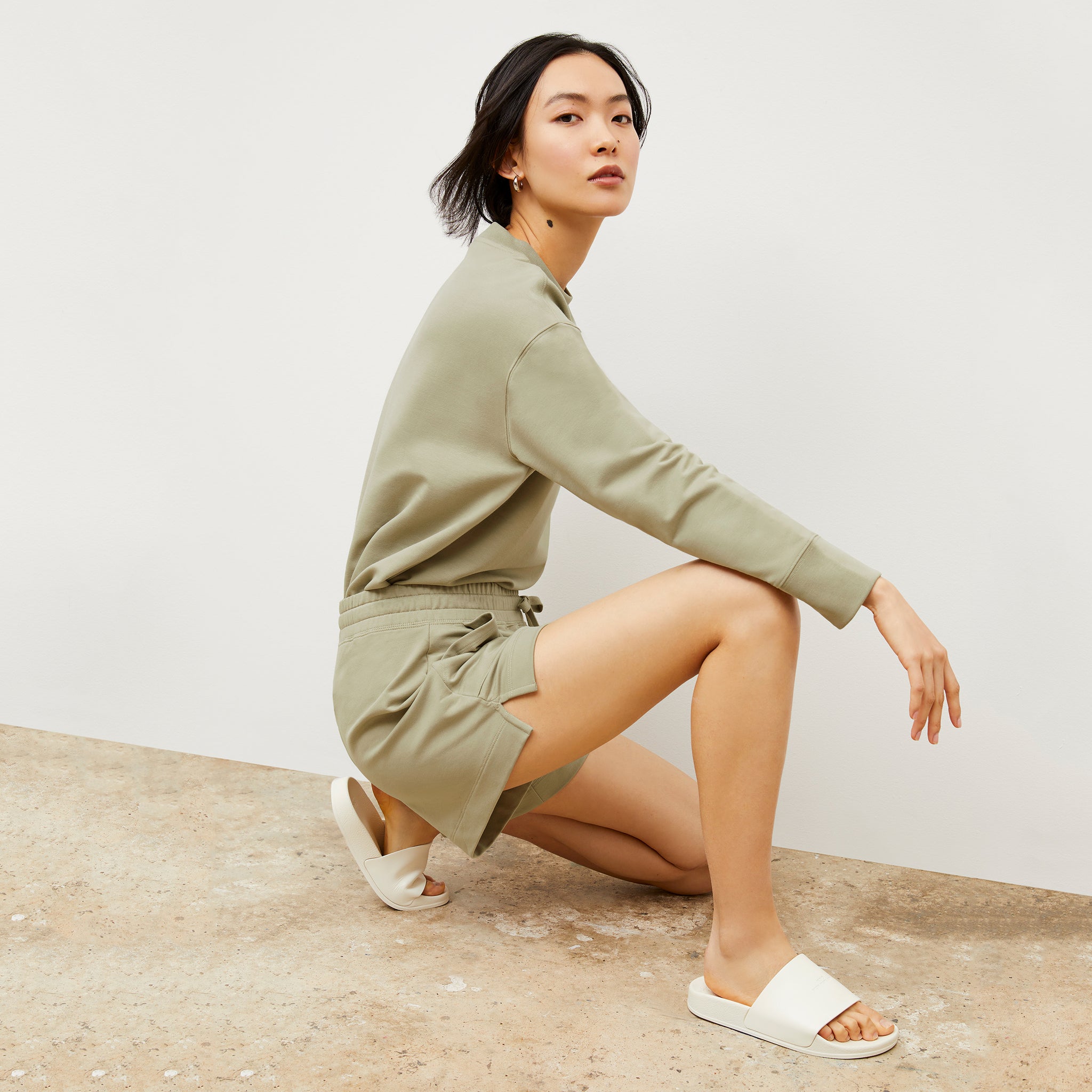 Side image of a woman wearing the Felix Short - Light French Terry in Laurel Green