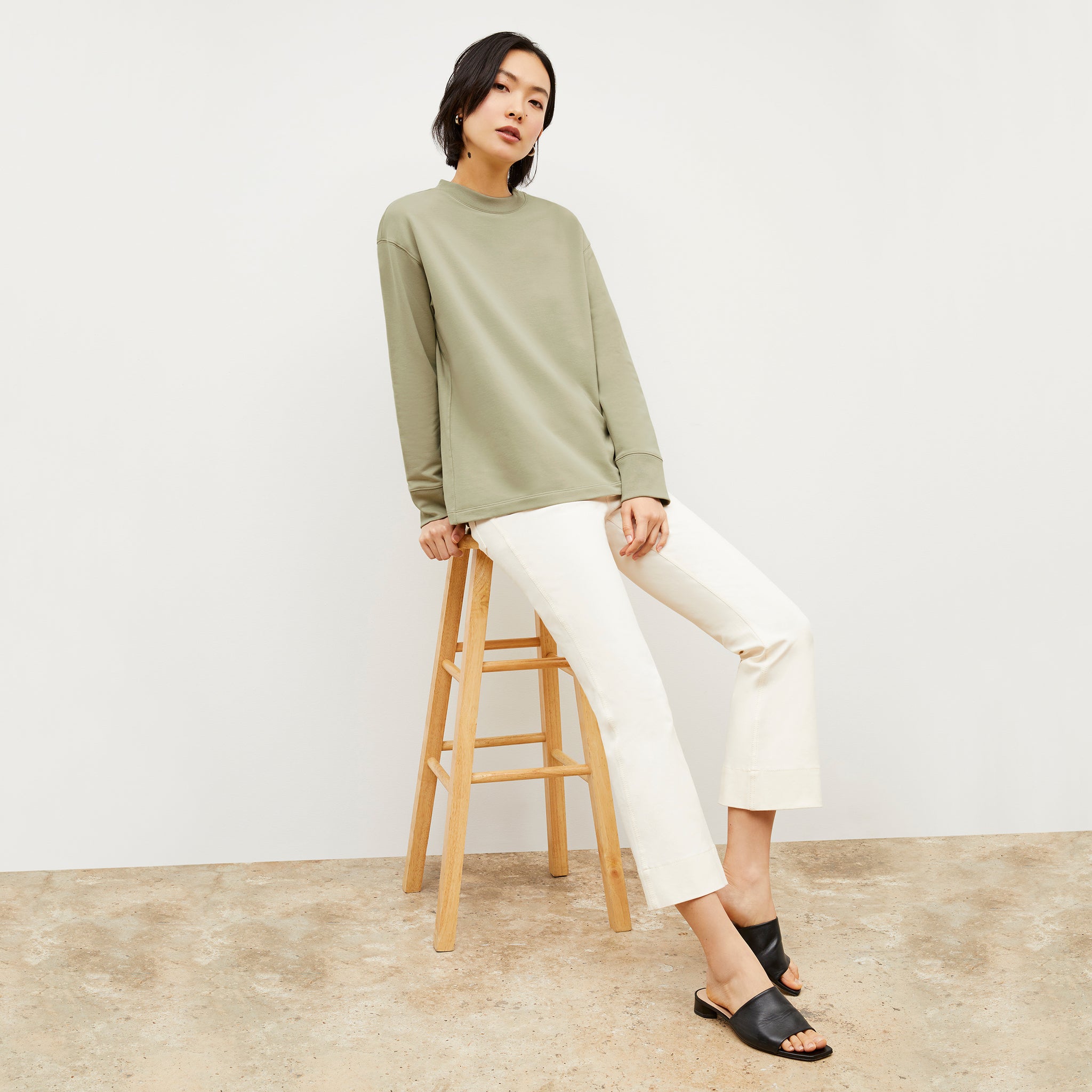 Front image of a woman wearing the Ellie Pullover - Light French Terry in Laurel Green 