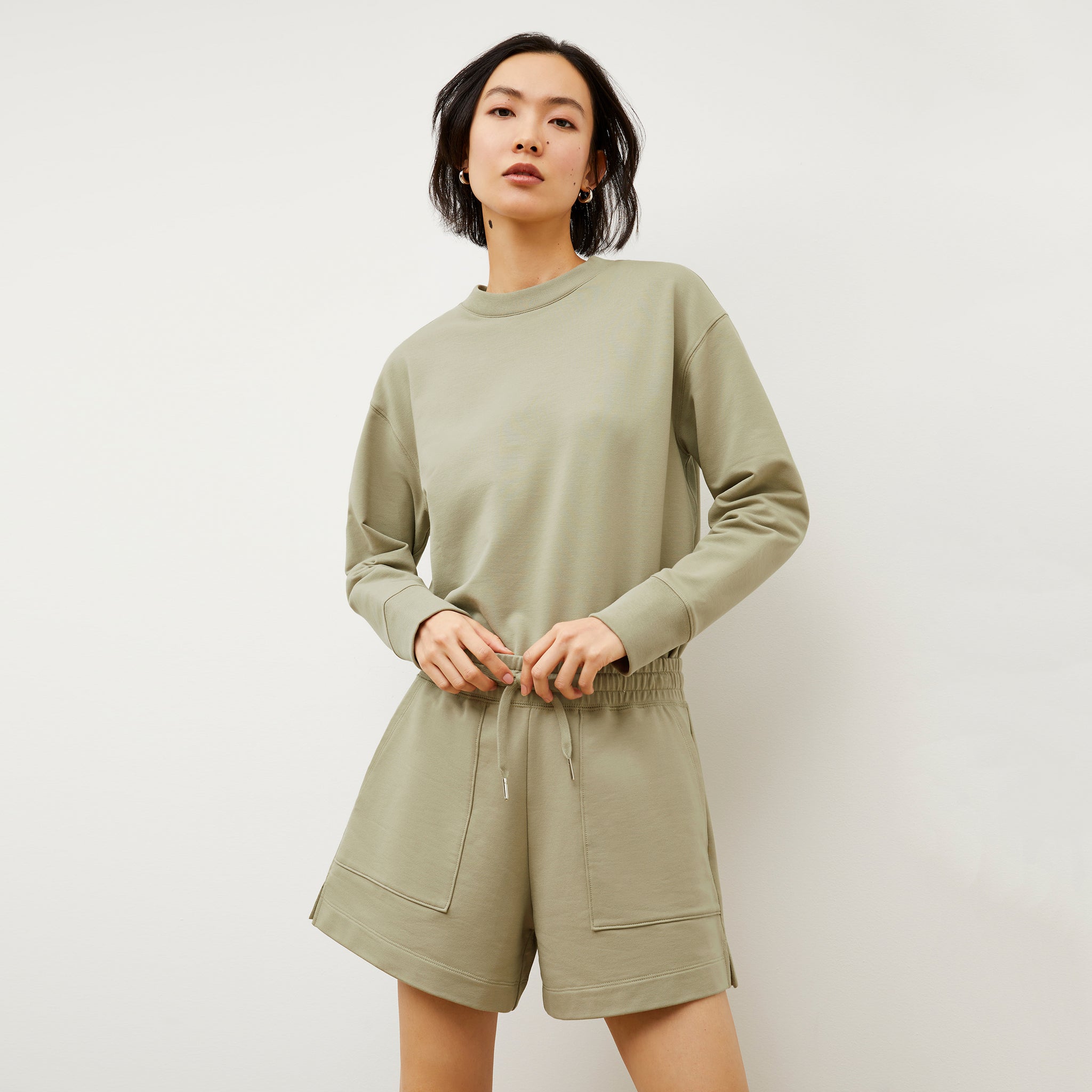 Front image of a woman wearing the Felix Short - Light French Terry in Laurel Green
