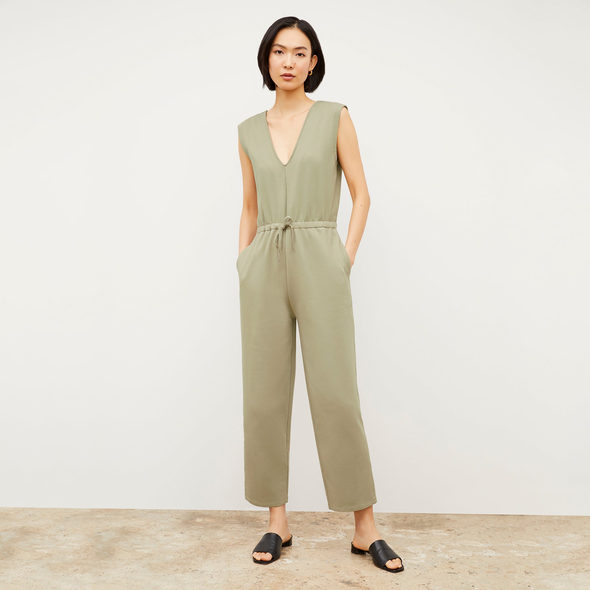 Front image of a woman wearing the Janet Jumpsuit - Light French Terry in Laurel Green 