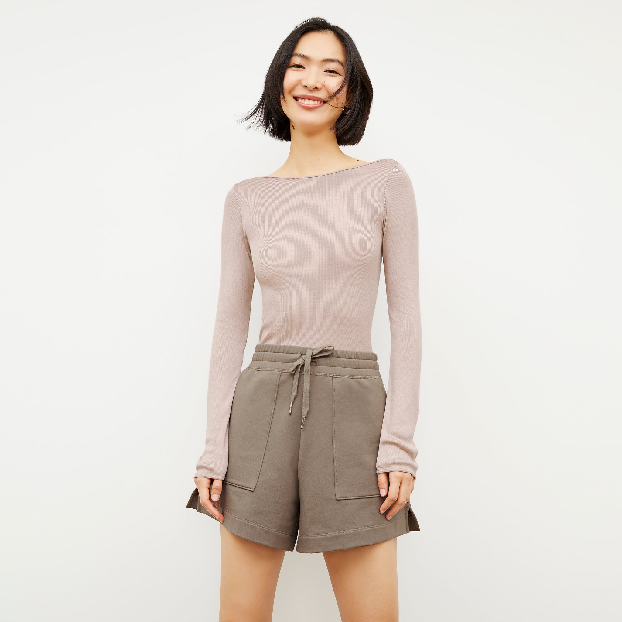 Front image of a woman wearing the Felix Short - Light French Terry in Light Truffle 