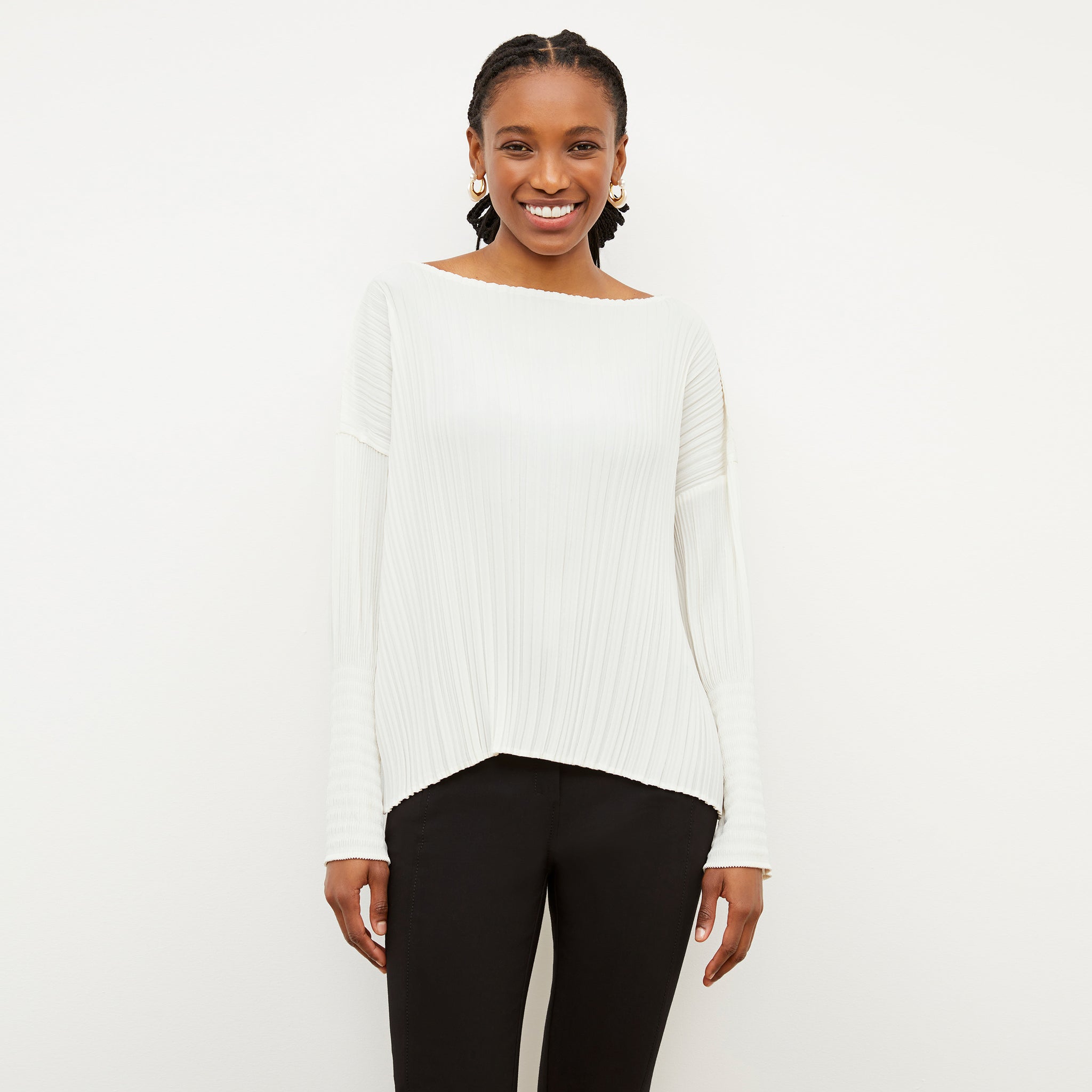 Front image of a woman wearing the Lasha Top - Micro Pleat in Ivory 