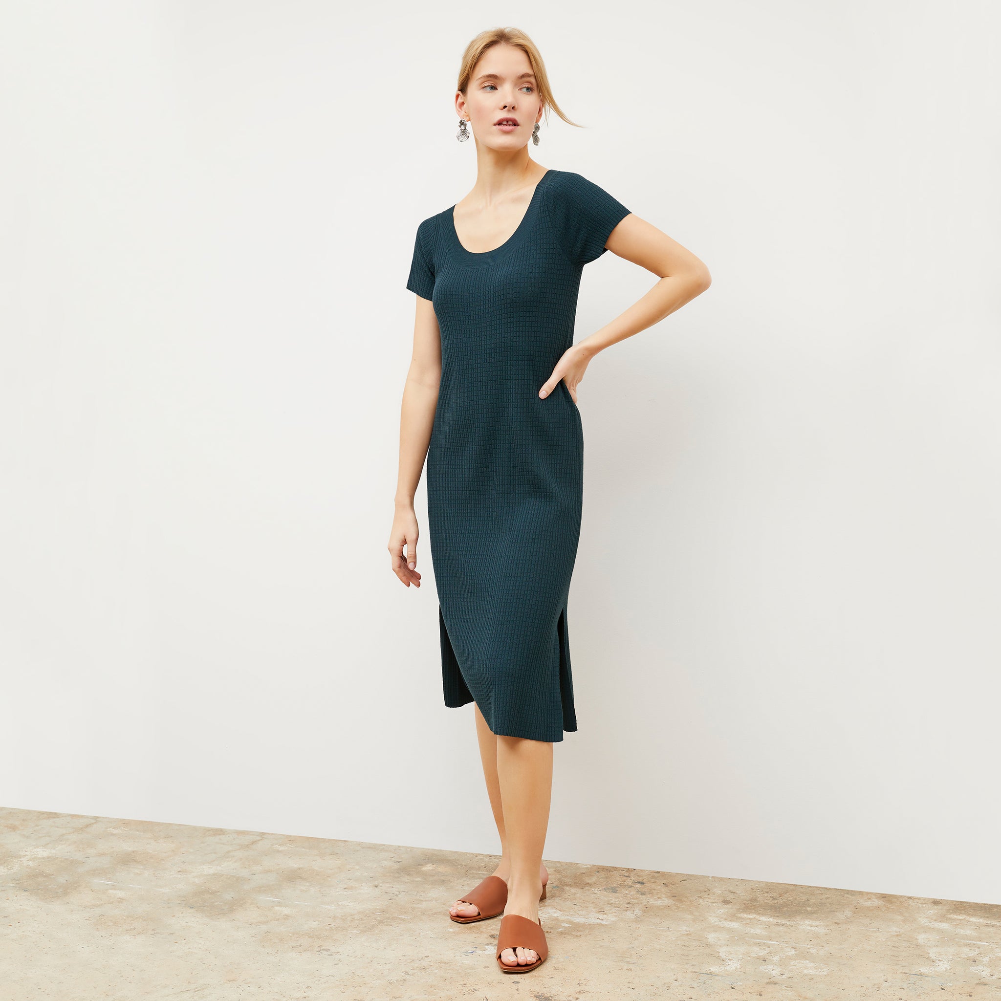 Front image of a woman wearing the Danica Dress - Geo Micro Knit in Deep Sea 