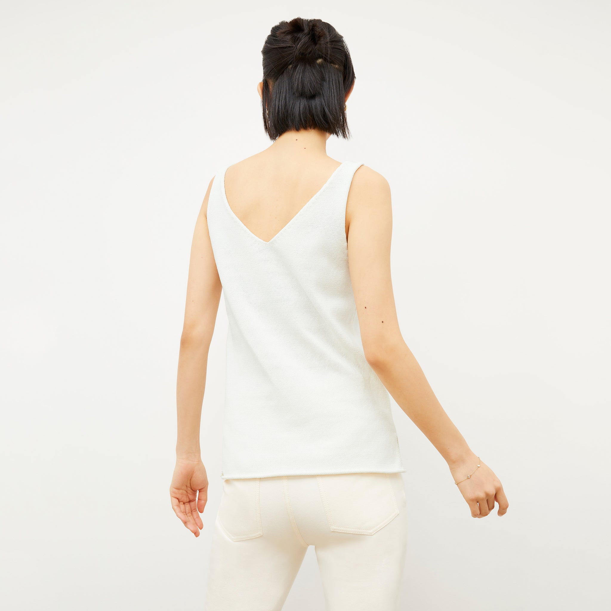 Image of a woman wearing the Melody Tank in Ivory