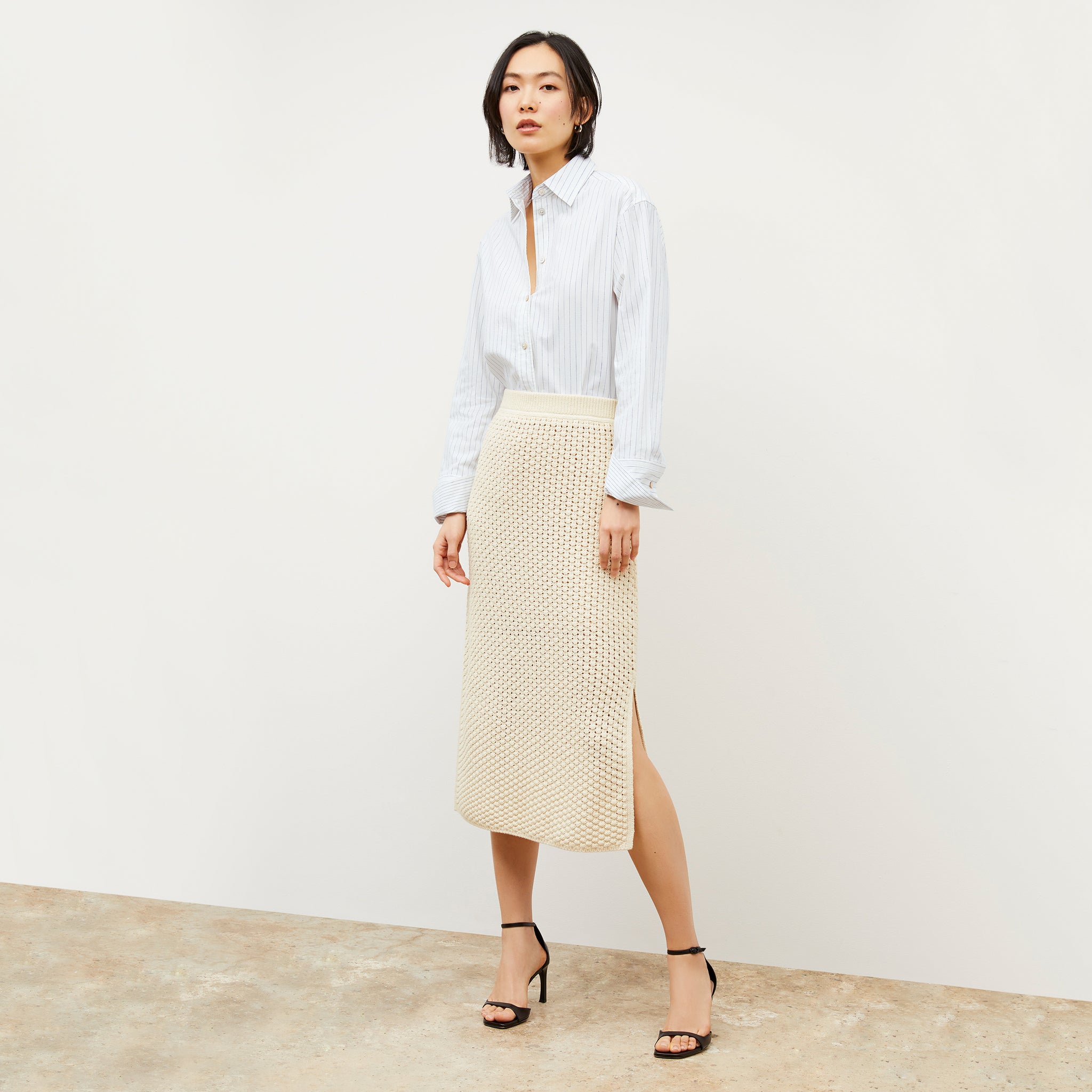 Front image of a woman wearing the Senga skirt in coconut