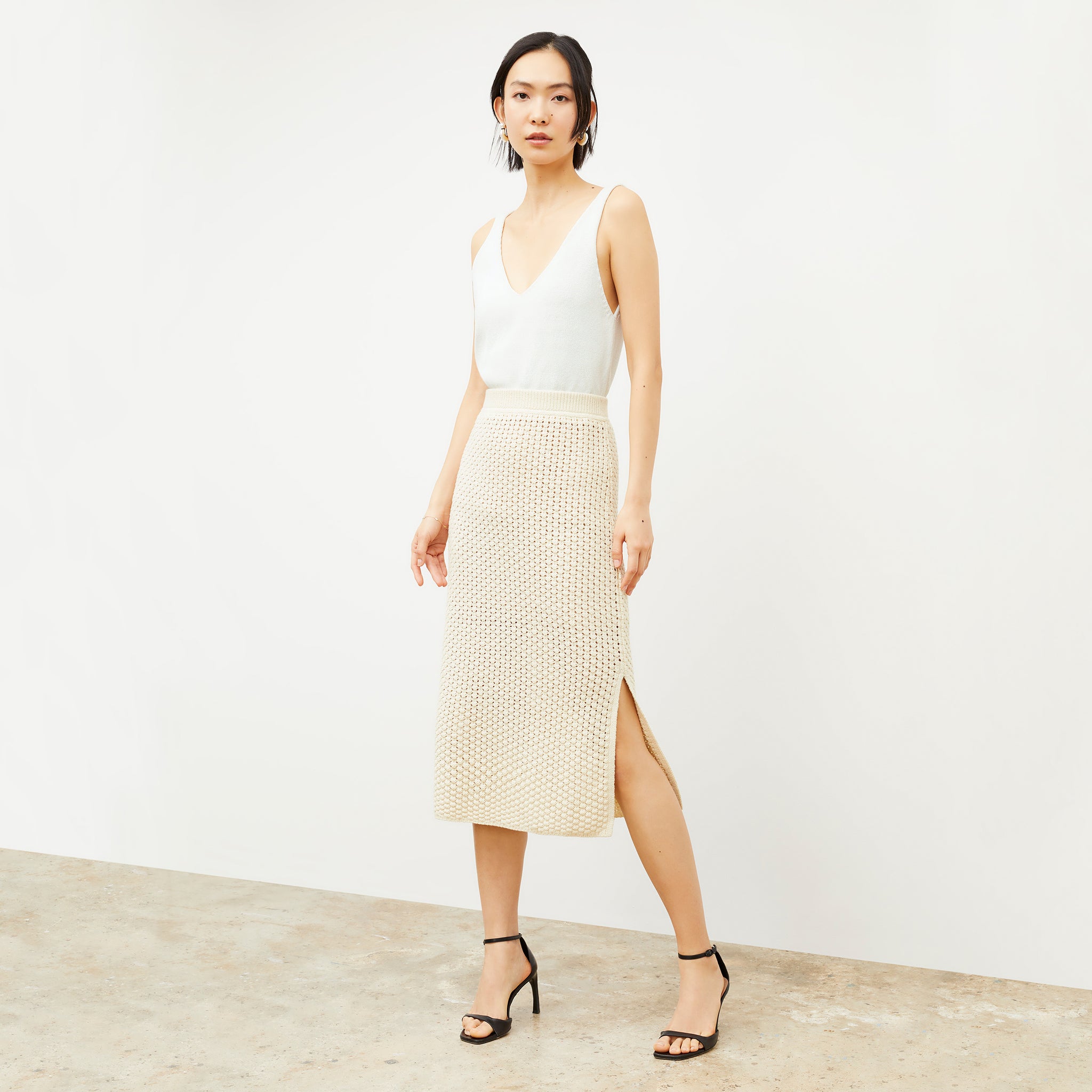 Front image of a woman wearing the Senga skirt in coconut 