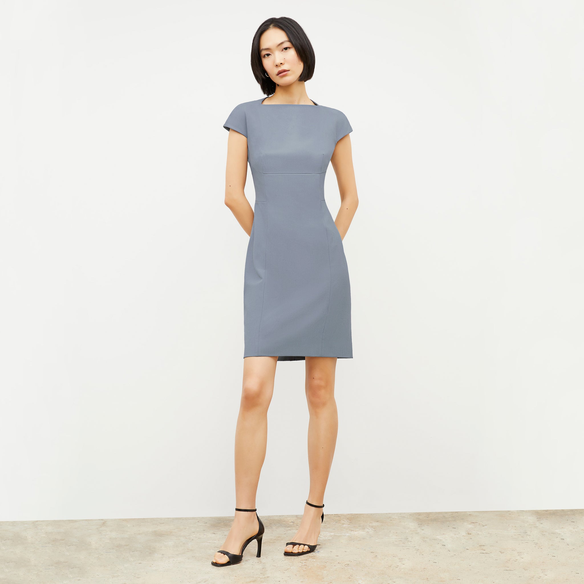Front image of a woman wearing the Ashley Dress - Recycled Wondertex in Steel Blue 