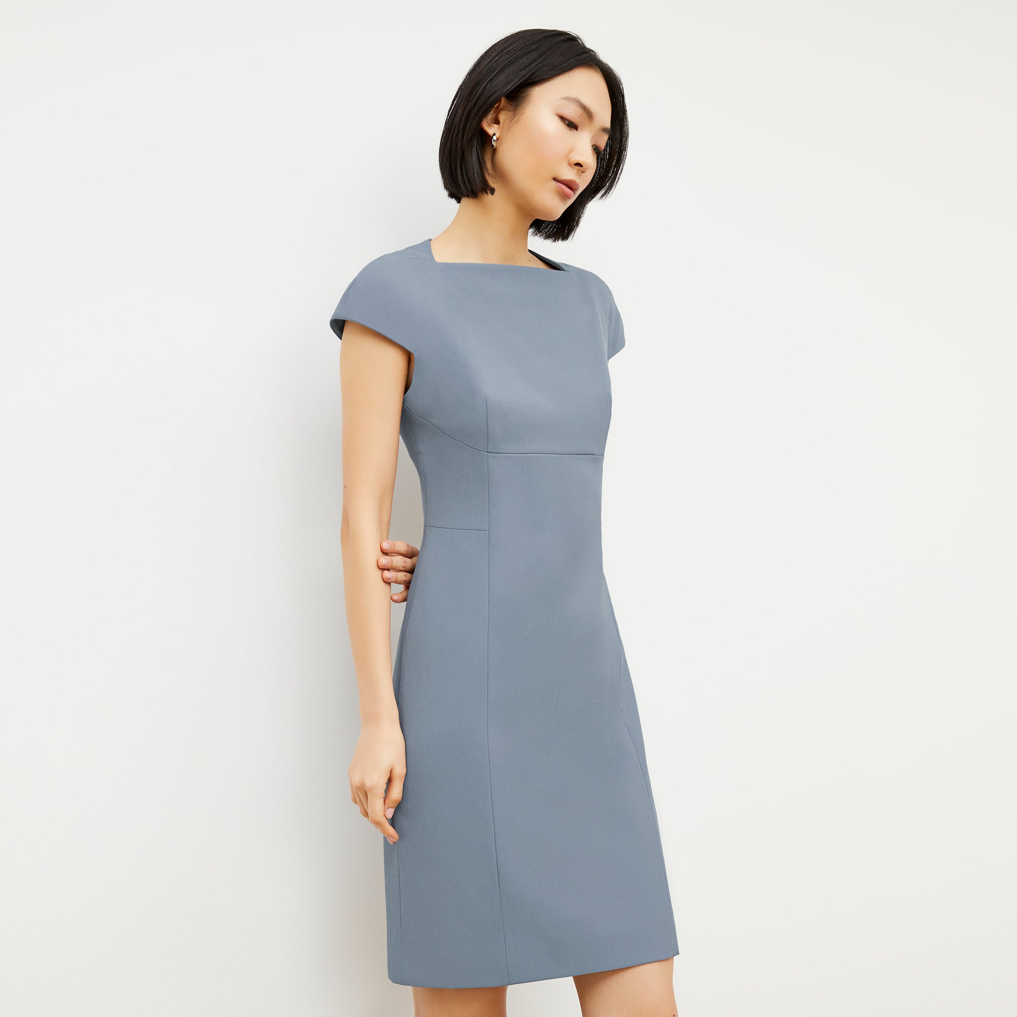 Side image of a woman wearing the Ashley Dress - Recycled Wondertex in Steel Blue