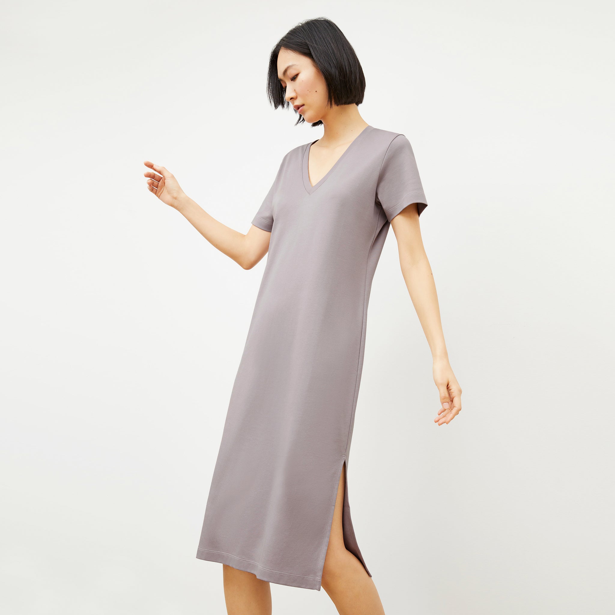 Side image of a woman wearing the Renee Dress - Pima Cotton in Wisteria