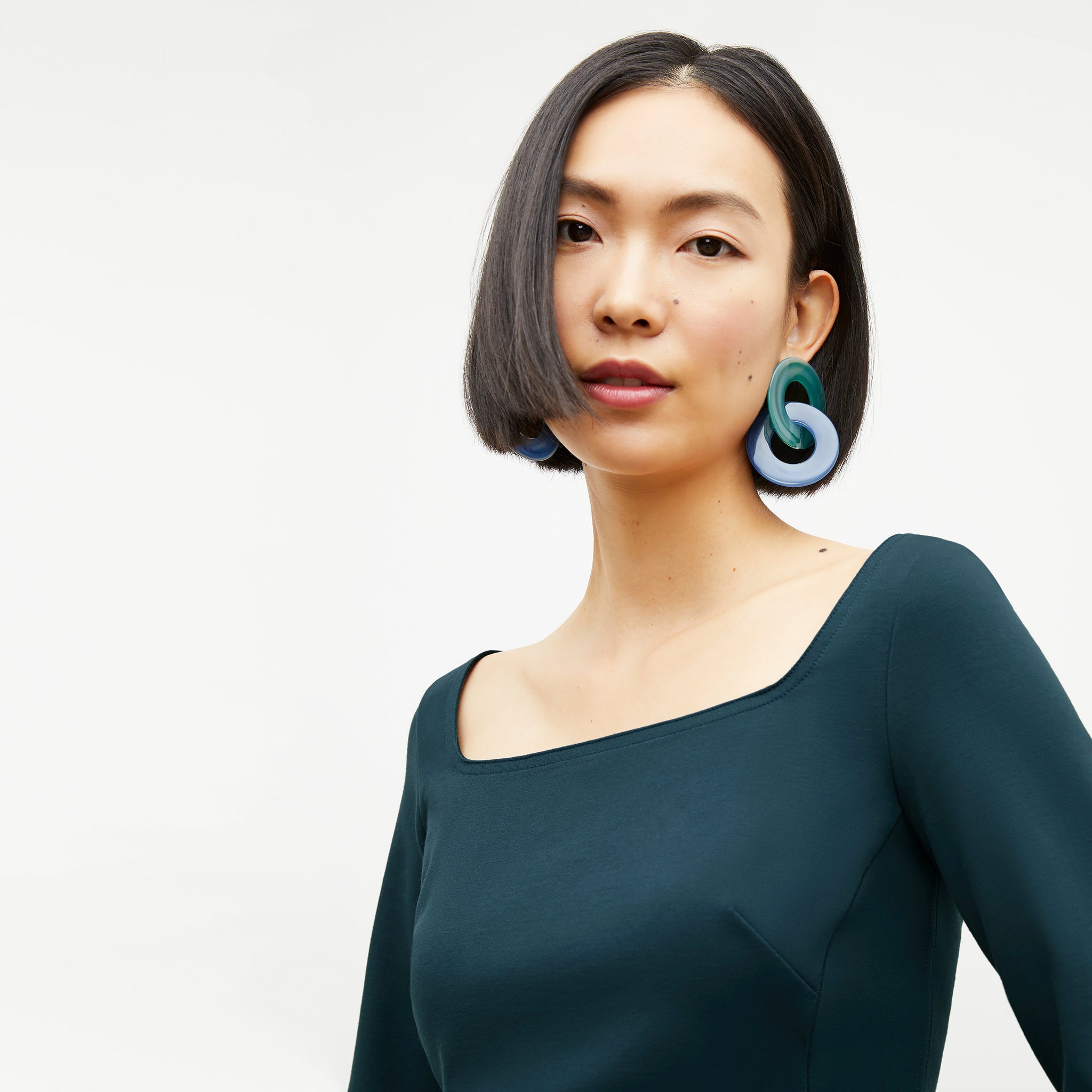 Front image of a woman wearing the Yuna Earrings in Blue Multi