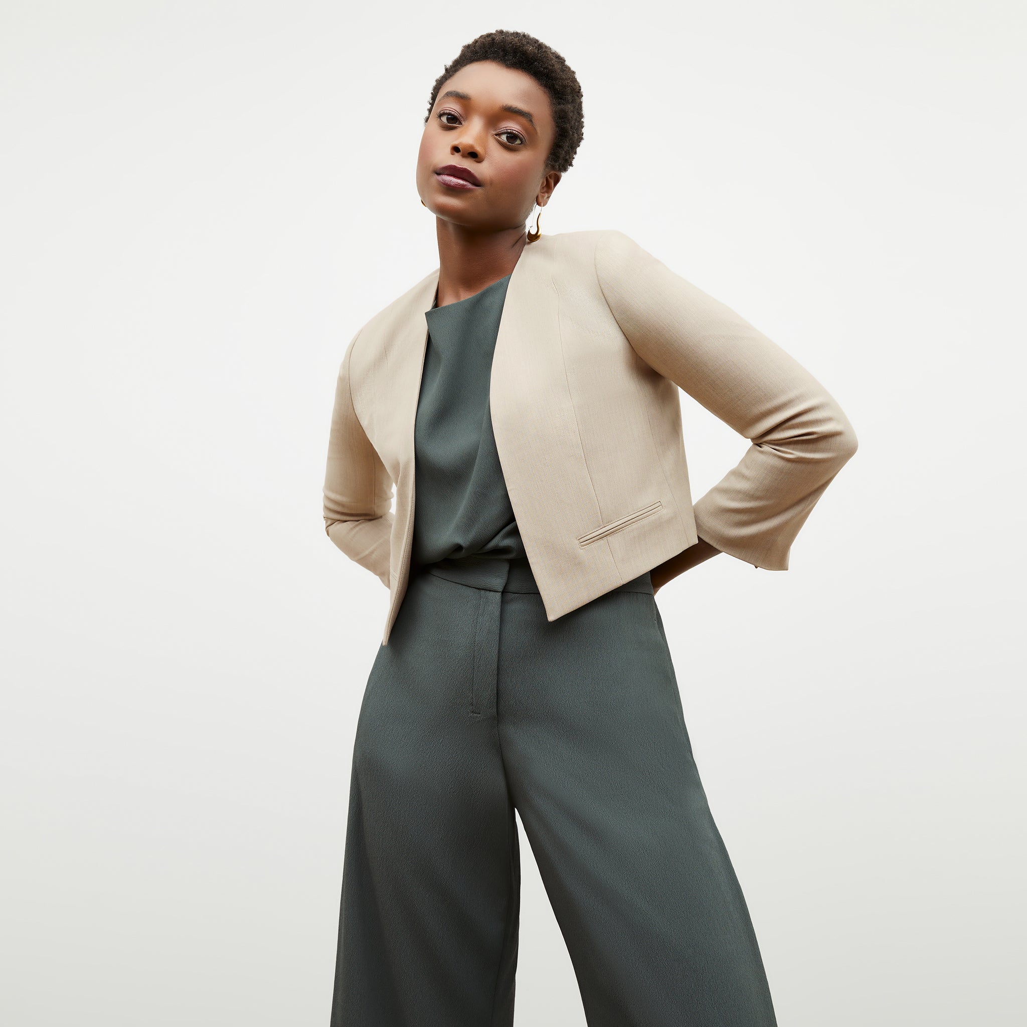 Side image of a woman wearing the Neale Jacket in Natural Melange