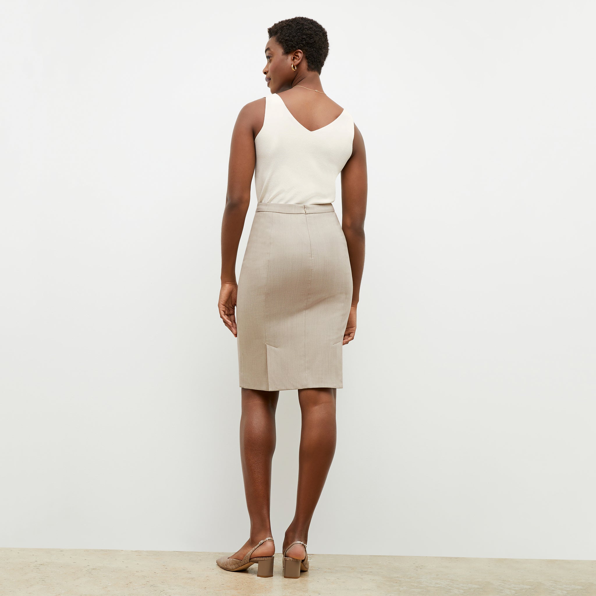 Back image of a woman wearing the Cobble Hill Skirt in Natural Melange