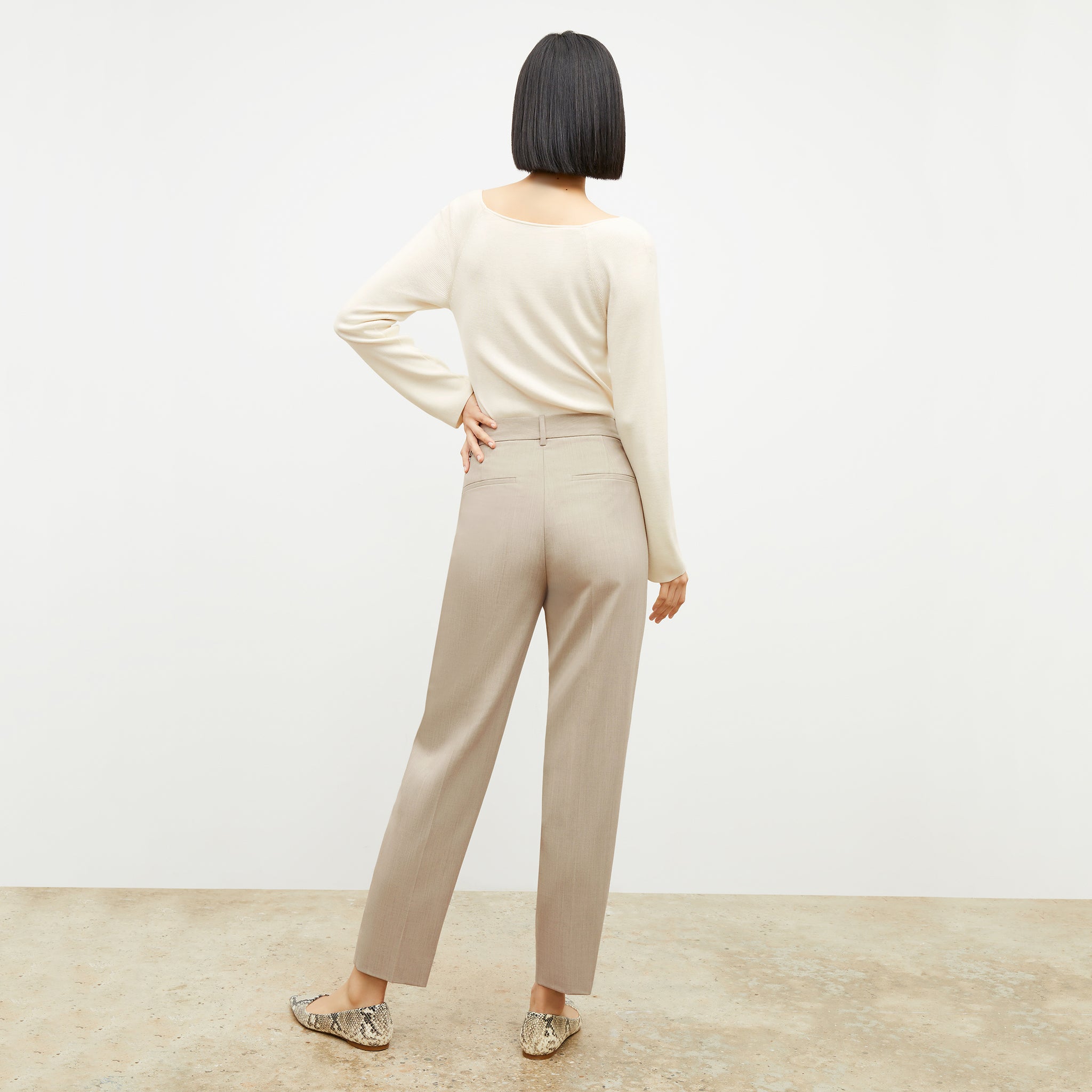 Back image of a woman wearing the Mejia Pant in Natural Melange