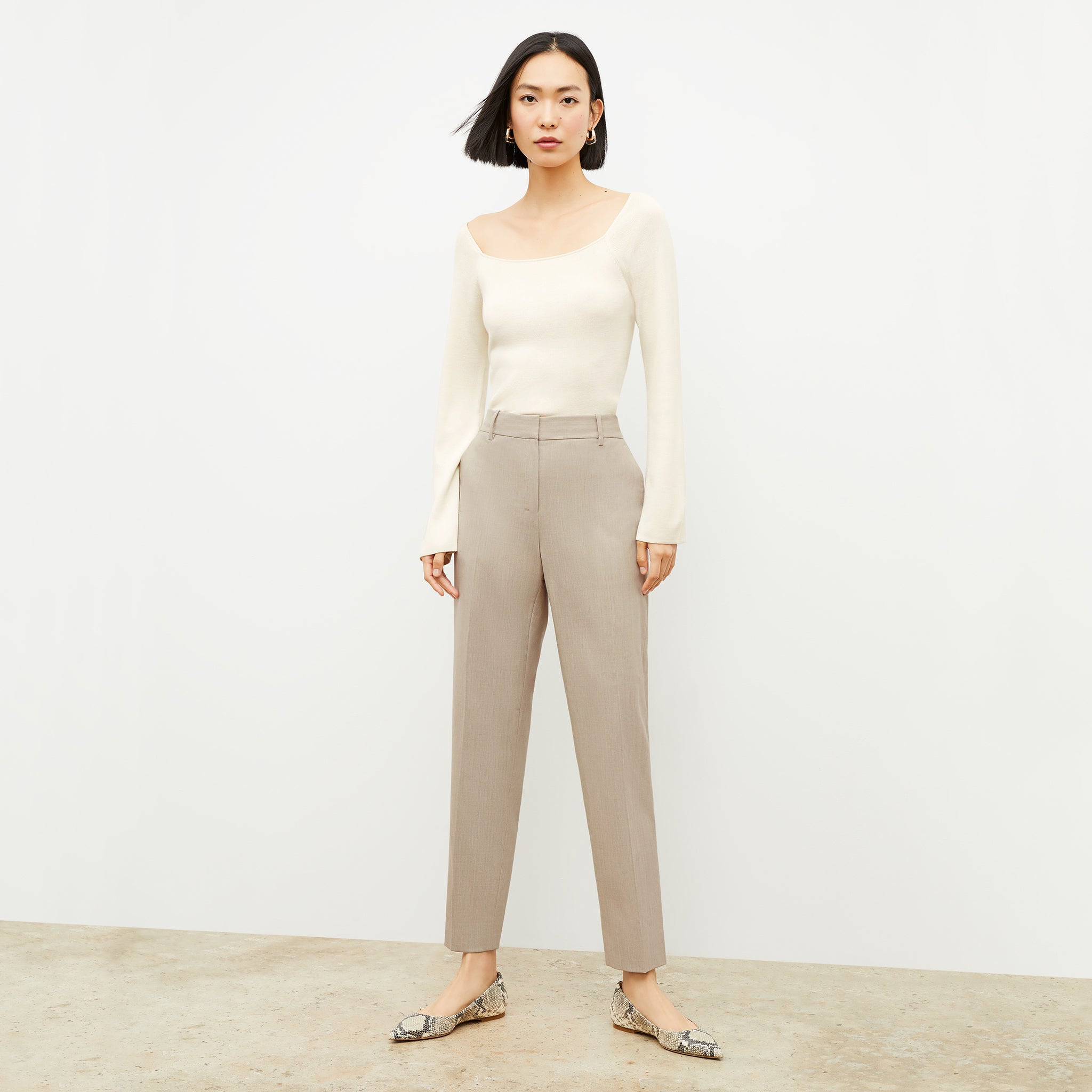 Front image of a woman wearing the Mejia Pant in Natural Melange 