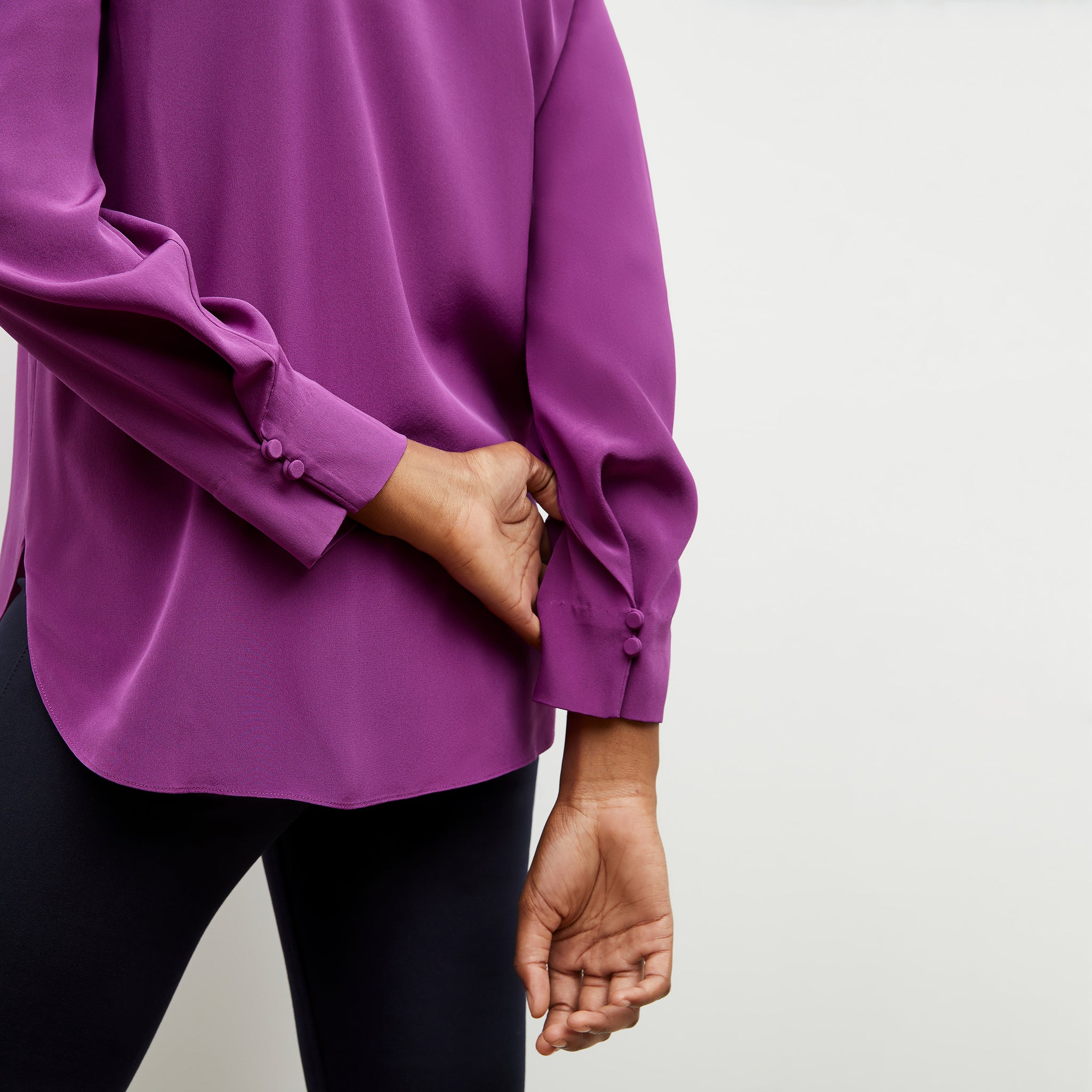 Back sleeve detail image of a woman wearing the Darcy Top in Purple Jasper