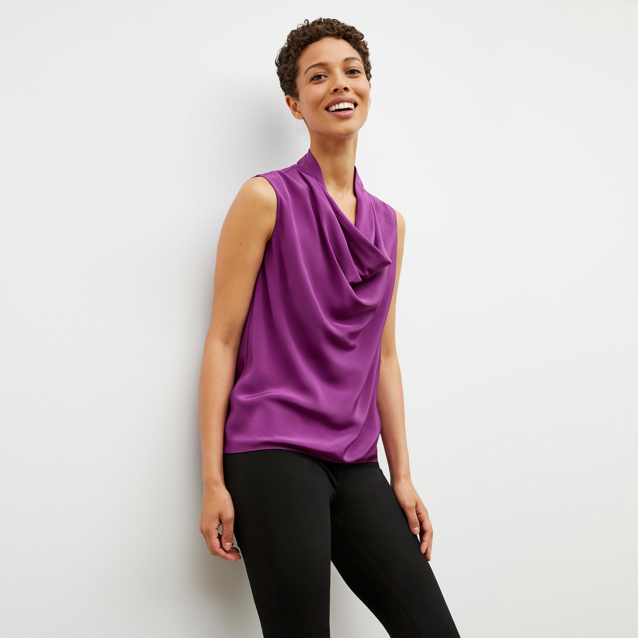 Front image of a woman wearing the Sloane top in purple jasper 