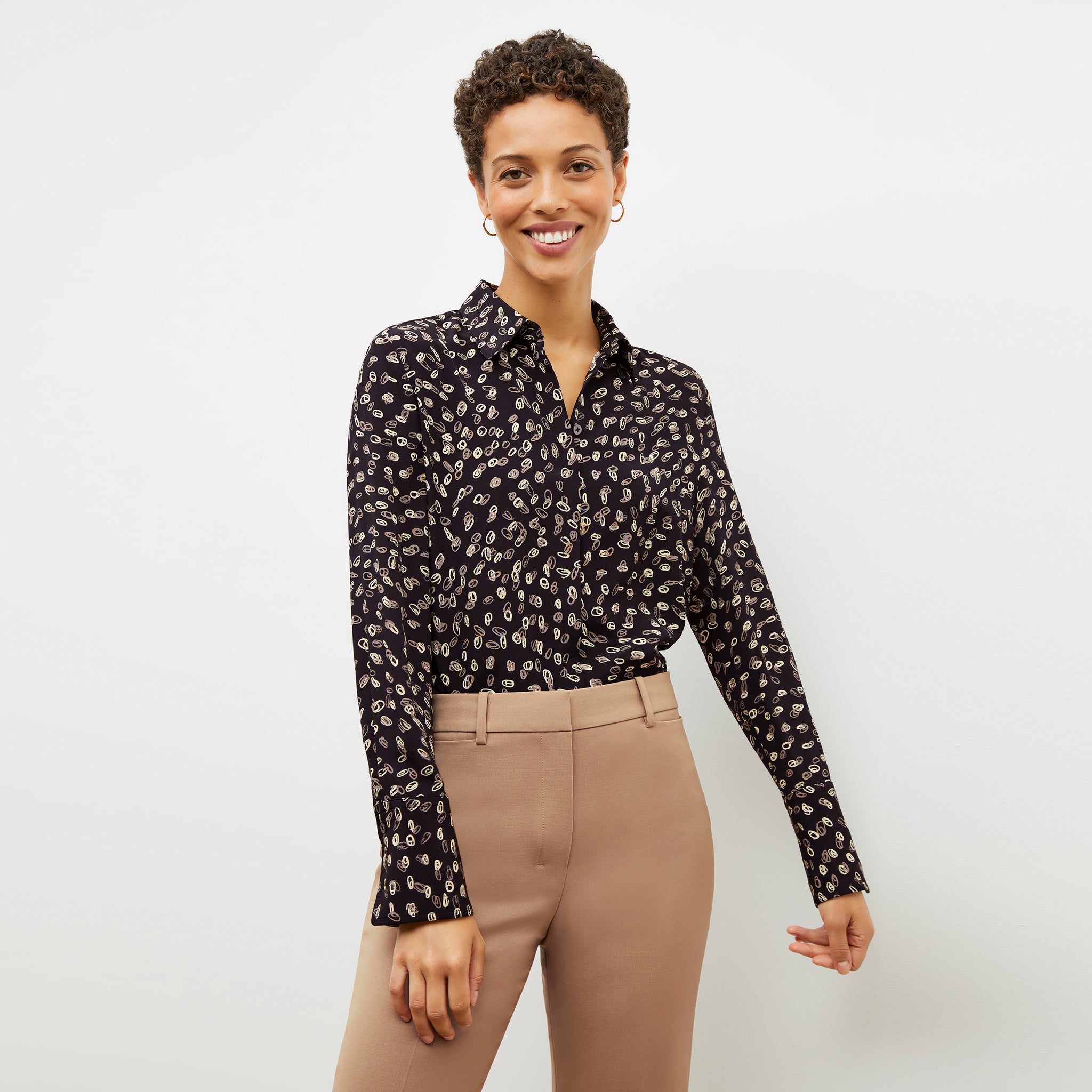 Front image of a woman wearing the Tatum Top in Spin Dot 