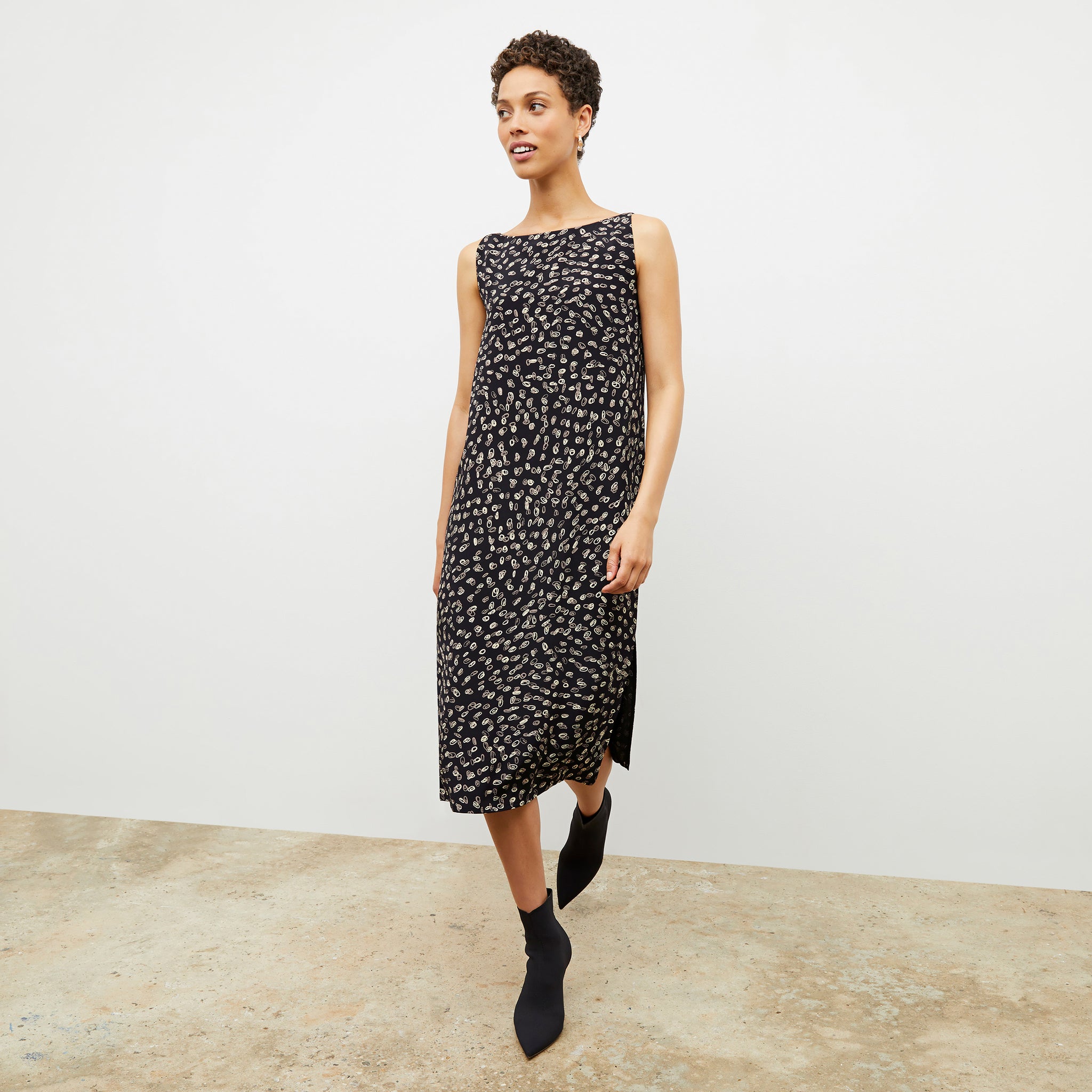 Front image of a woman wearing the Bevin Dress in Spin Dot 