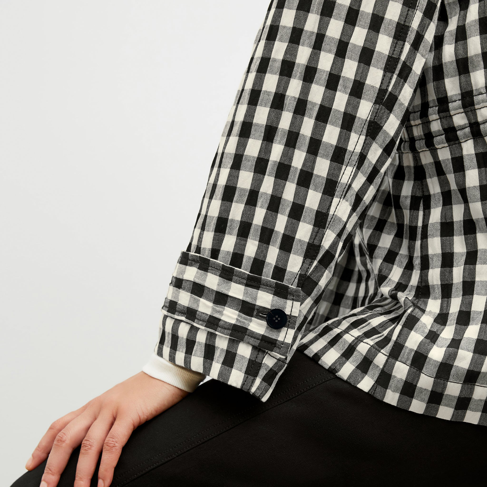 Detail image of a woman wearing the Allison Anorak - Luxe Gingham in black / white