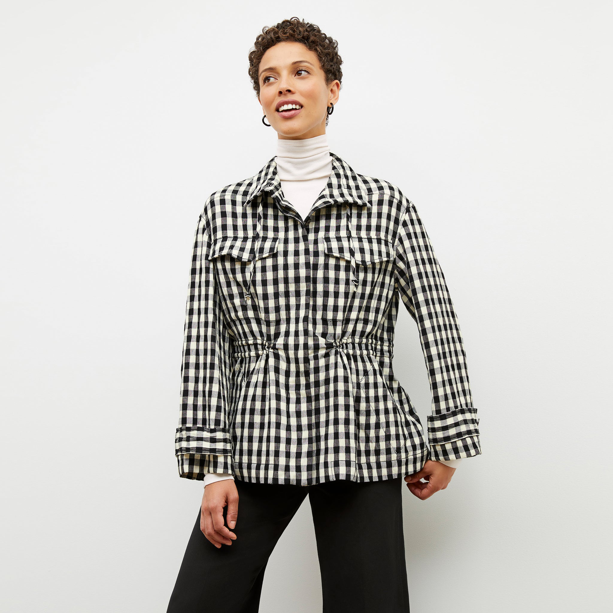 Front image of a woman wearing the Allison Anorak - Luxe Gingham in black / white