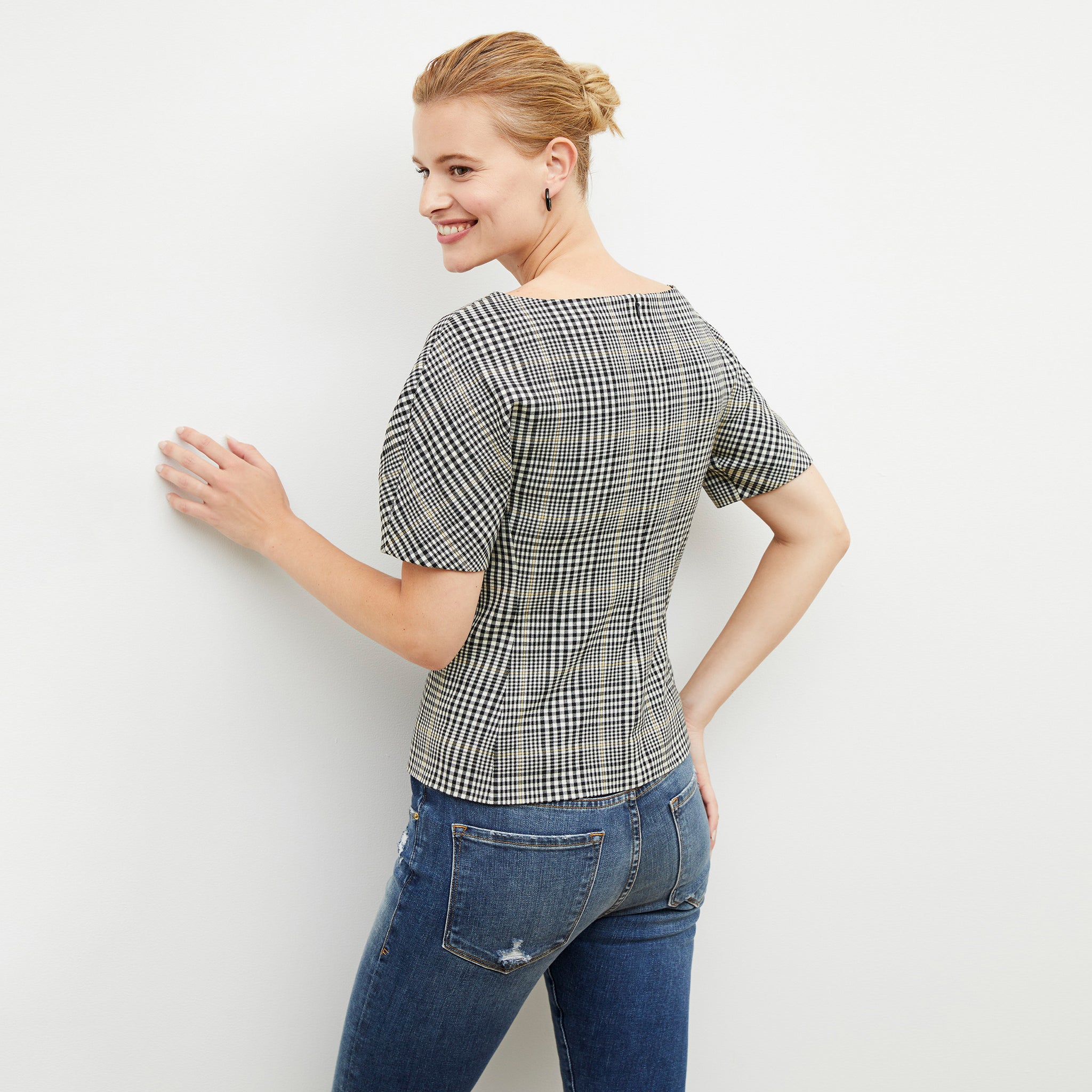 Back image of a woman wearing the eudora top in plaid sharkskin