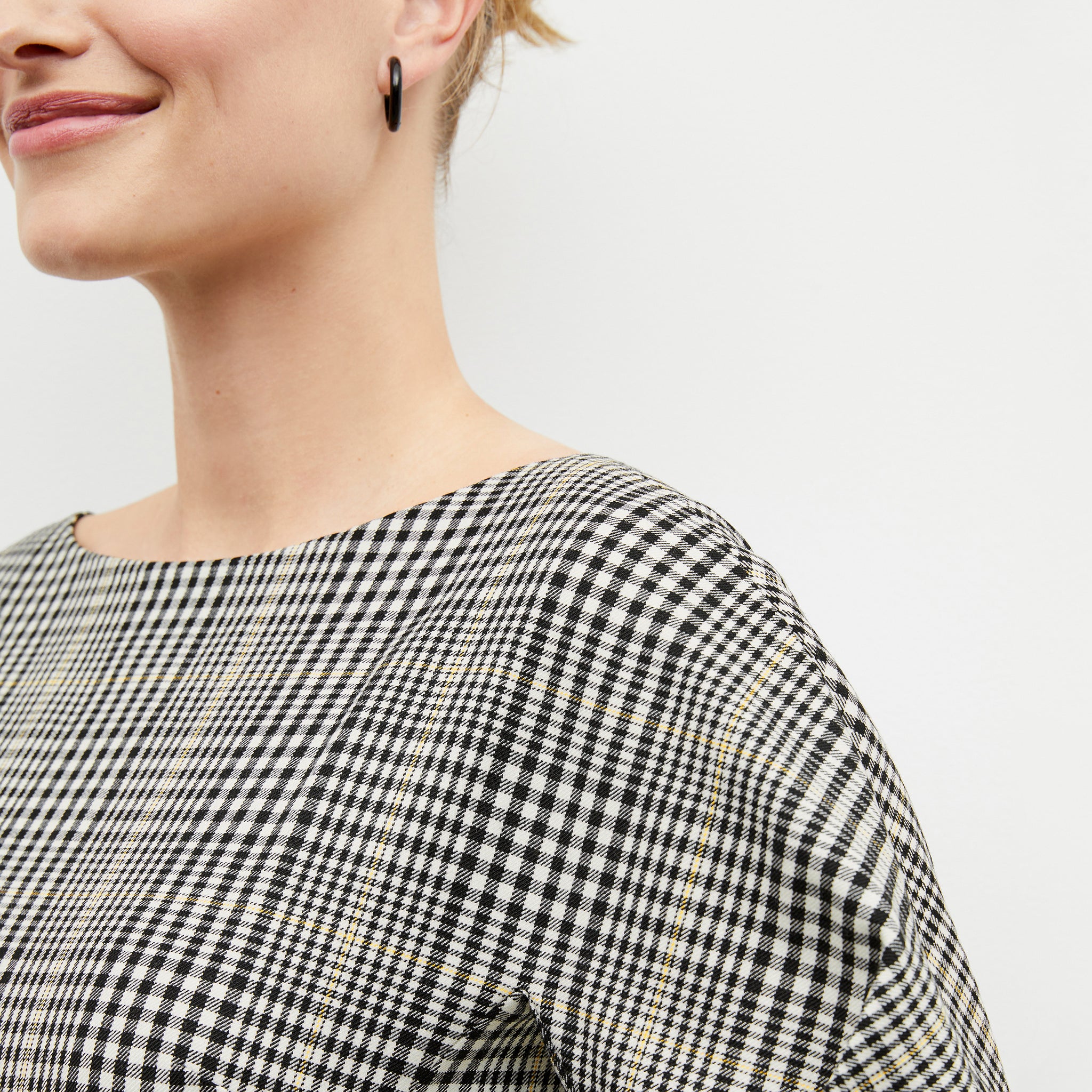 Front image of a woman wearing the eudora top in plaid sharkskin