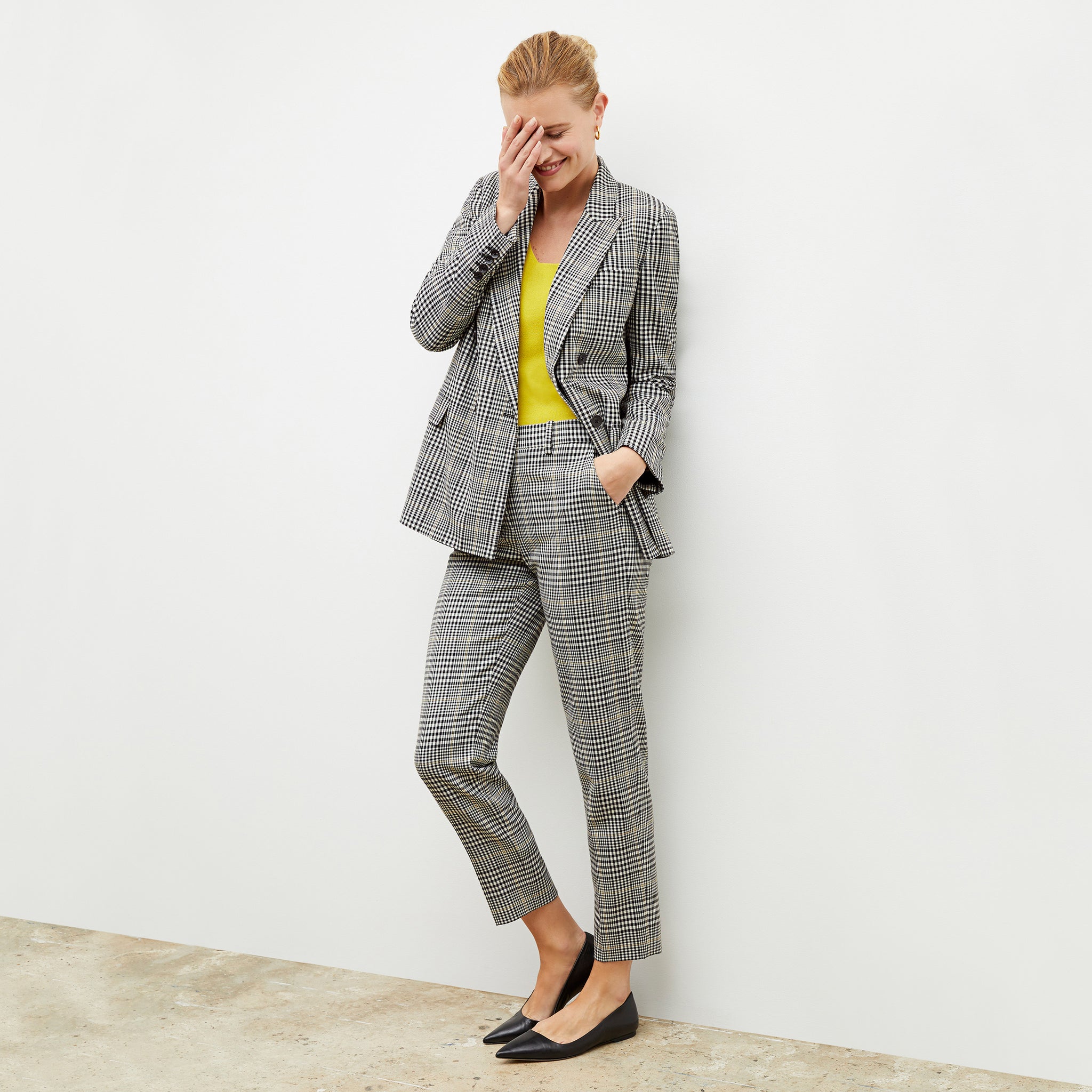 Front image of a woman wearing the mejia pant in plaid sharkskin 